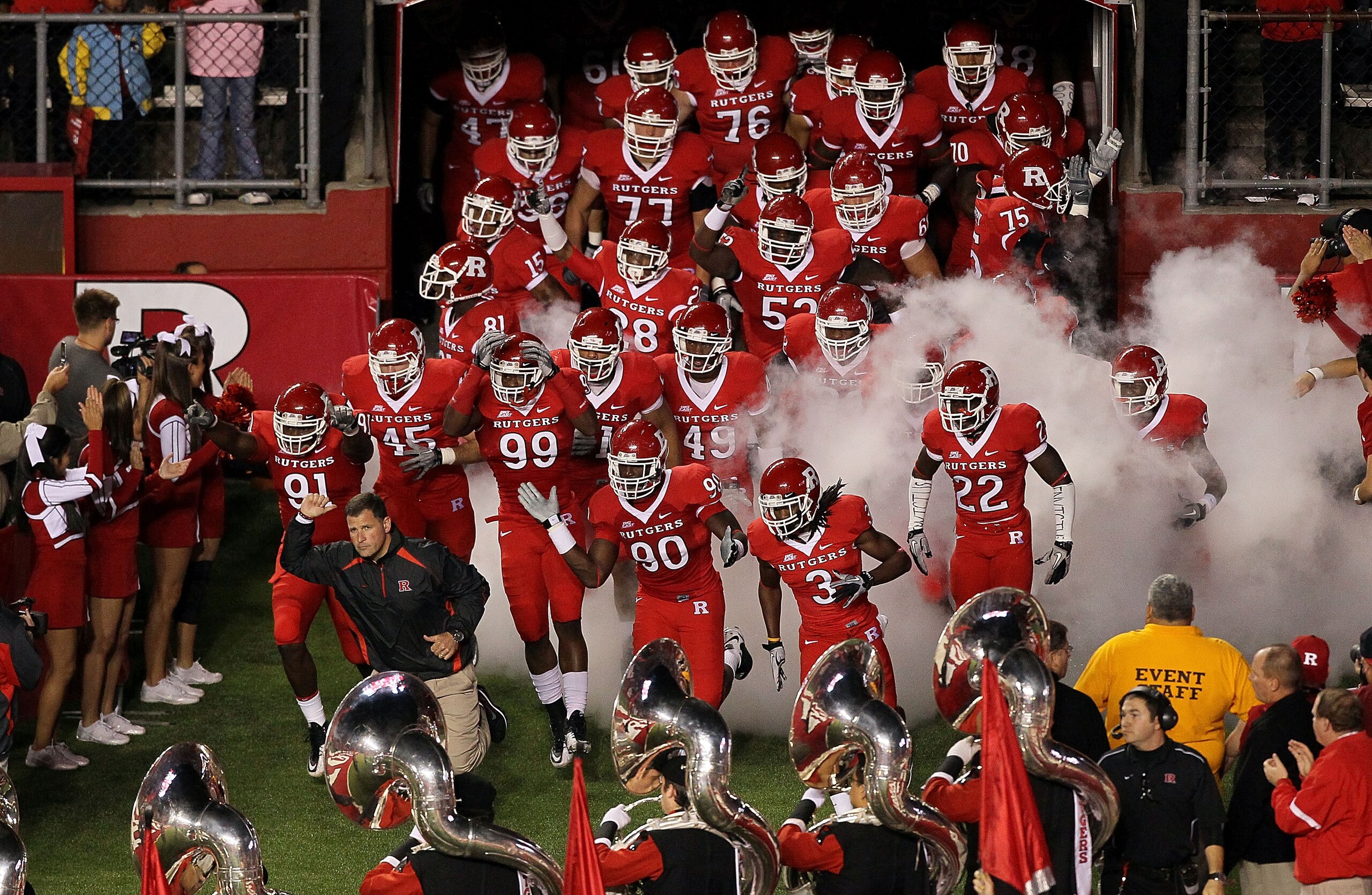PISCATAWAY, NJ - OCTOBER 08: Head coach Greg Schiano of the Rutgers Scarlet Knights leads his team onto the field to play against the Connecticut Huskies at Rutgers Stadium on October 8, 2010 in Piscataway, New Jersey. (Photo by Jim McIsaac/Getty Images PISCATAWAY, NJ - OCTOBER 08: Head coach Greg Schiano of the Rutgers Scarlet Knights leads his team onto the field to play against the Connecticut Huskies at Rutgers Stadium on October 8, 2010 in Piscataway, New Jersey. (Photo by Jim McIsaac/Getty Images