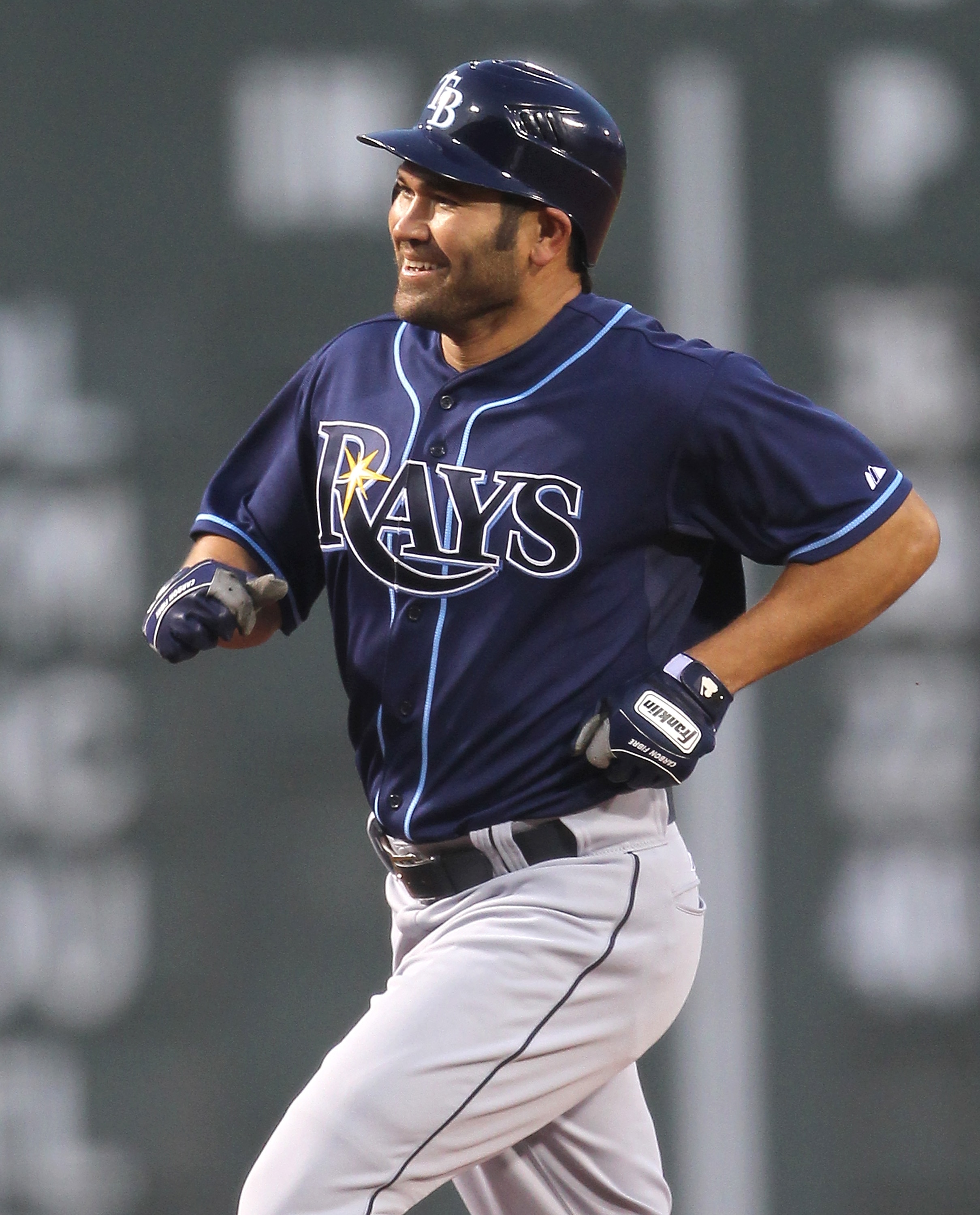 BOSTON, MA - APRIL 11:  Johnny Damon #22 of the Tampa Bay Rays rounds the bases after hitting a home run in the first inning against the Boston Red Sox at Fenway Park April 11, 2011 in Boston, Massachusetts. (Photo by Jim Rogash/Getty Images)