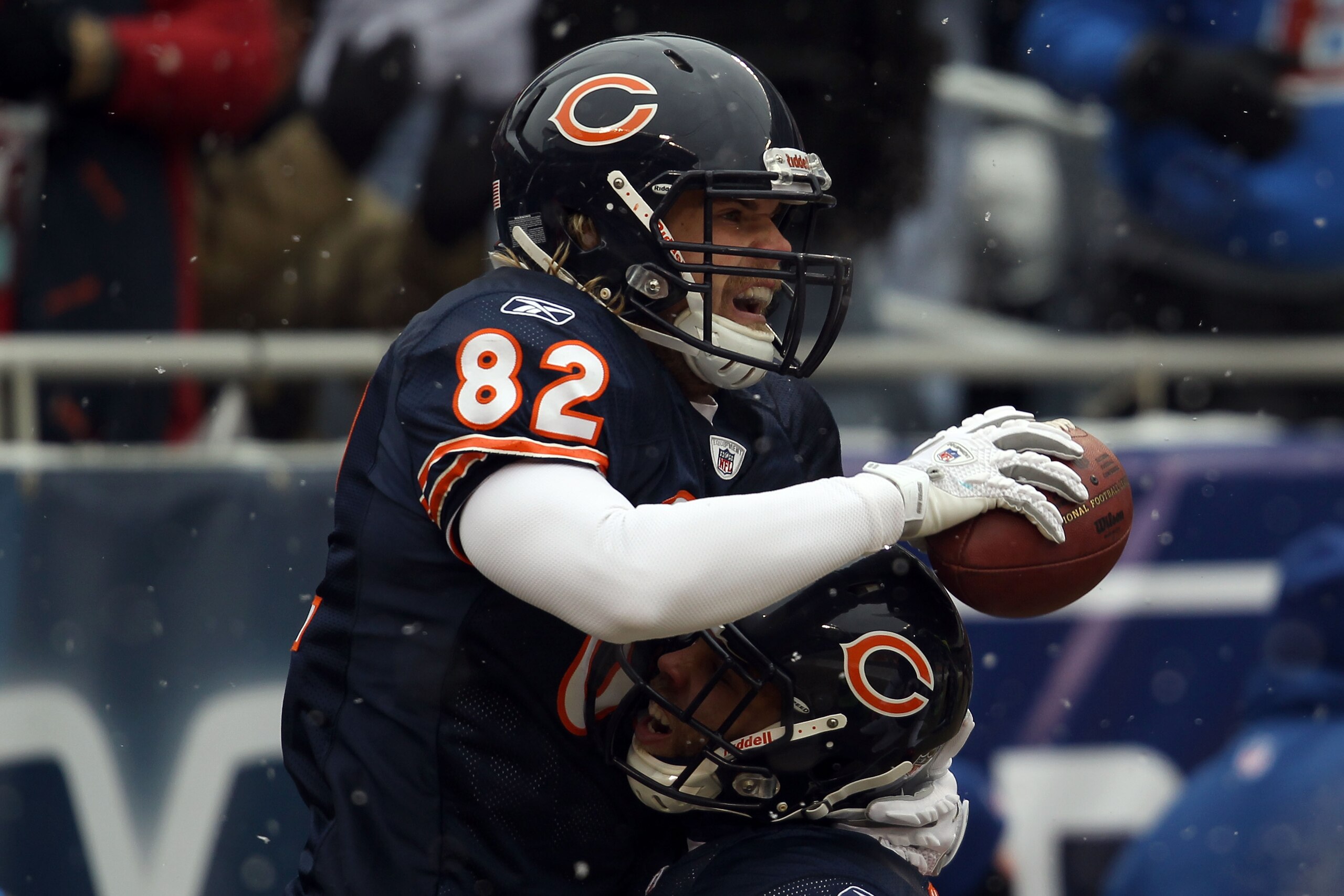 CHICAGO, IL - JANUARY 16:  Tight end Greg Olsen #82 of the Chicago Bears celebrates with Johnny Knox #13 after Olsen scores on a 58-yard touchdown reception in the first quarter against the Seattle Seahawks in the 2011 NFC divisional playoff game at Soldi