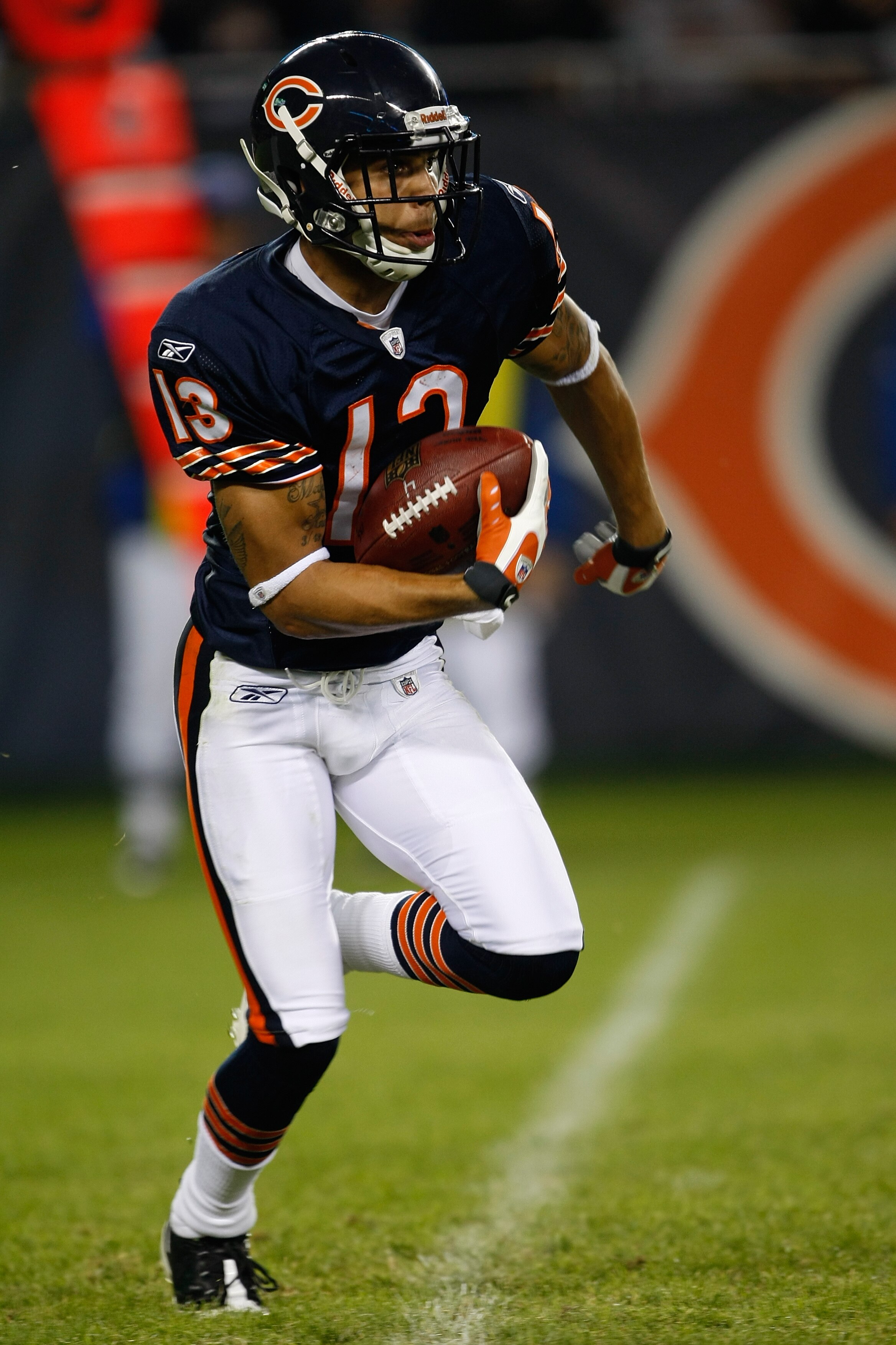 CHICAGO, IL - SEPTEMBER 3: Wide receiver Johnny Knox #13 of the Chicago Bears runs with the football against the Cleveland Browns at Soldier Field on September 3, 2009 in Chicago, Illinois. The Bears defeated the Browns 26-23. (Photo by Scott Boehm/Getty CHICAGO, IL - SEPTEMBER 3: Wide receiver Johnny Knox #13 of the Chicago Bears runs with the football against the Cleveland Browns at Soldier Field on September 3, 2009 in Chicago, Illinois. The Bears defeated the Browns 26-23. (Photo by Scott Boehm/Getty
