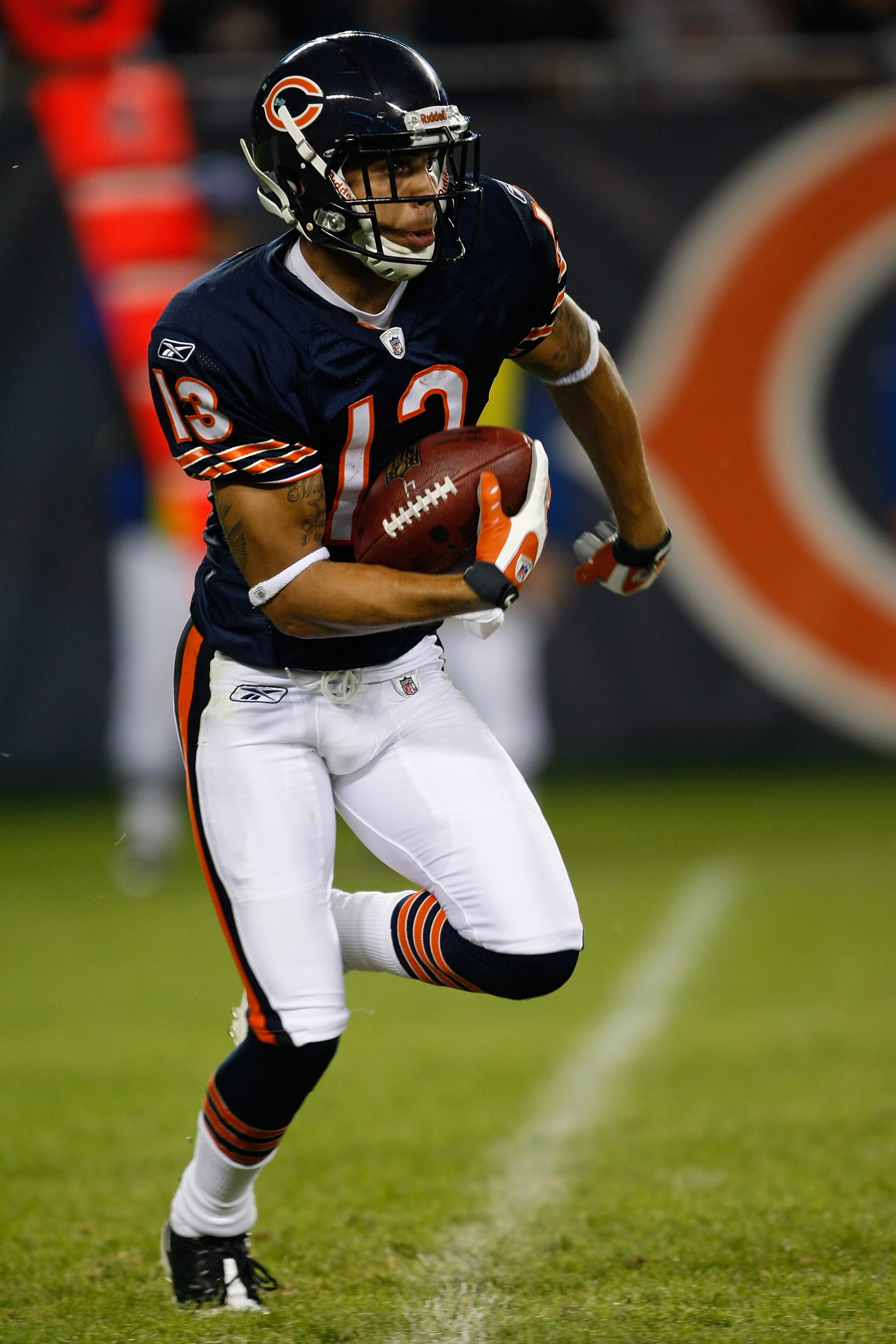 CHICAGO, IL - SEPTEMBER 3: Wide receiver Johnny Knox #13 of the Chicago Bears runs with the football against the Cleveland Browns at Soldier Field on September 3, 2009 in Chicago, Illinois. The Bears defeated the Browns 26-23. (Photo by Scott Boehm/Getty