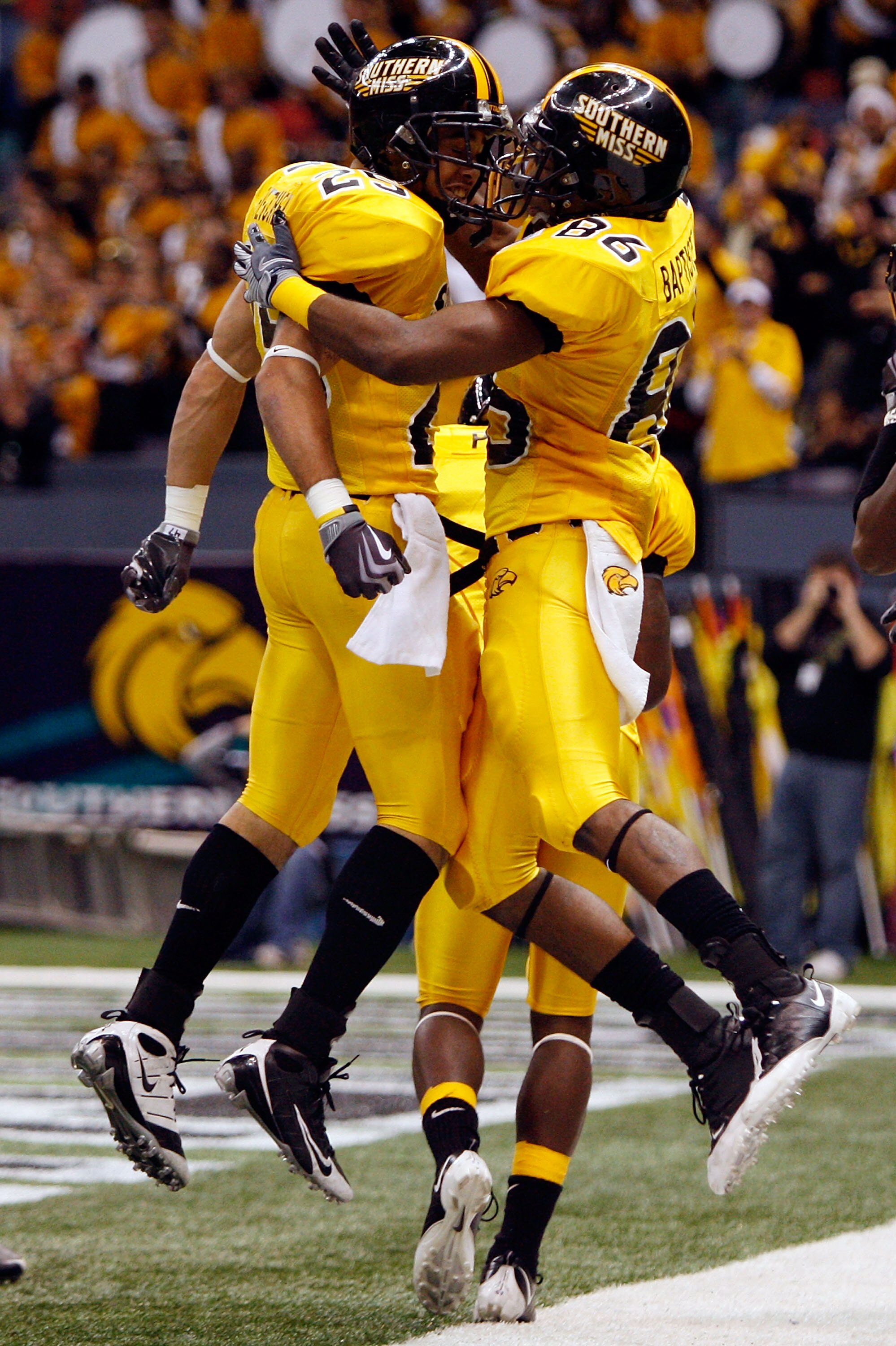 NEW ORLEANS - DECEMBER 21:  Damion Fletcher #25 and Gerald Baptiste #86 of the Southern Mississippi Golden Eagles celebrate after Baptiste scored on a 64 yard pass against the Troy Trojans on during the R+L Carriers New Orleans Bowl on December 21, 2008 a