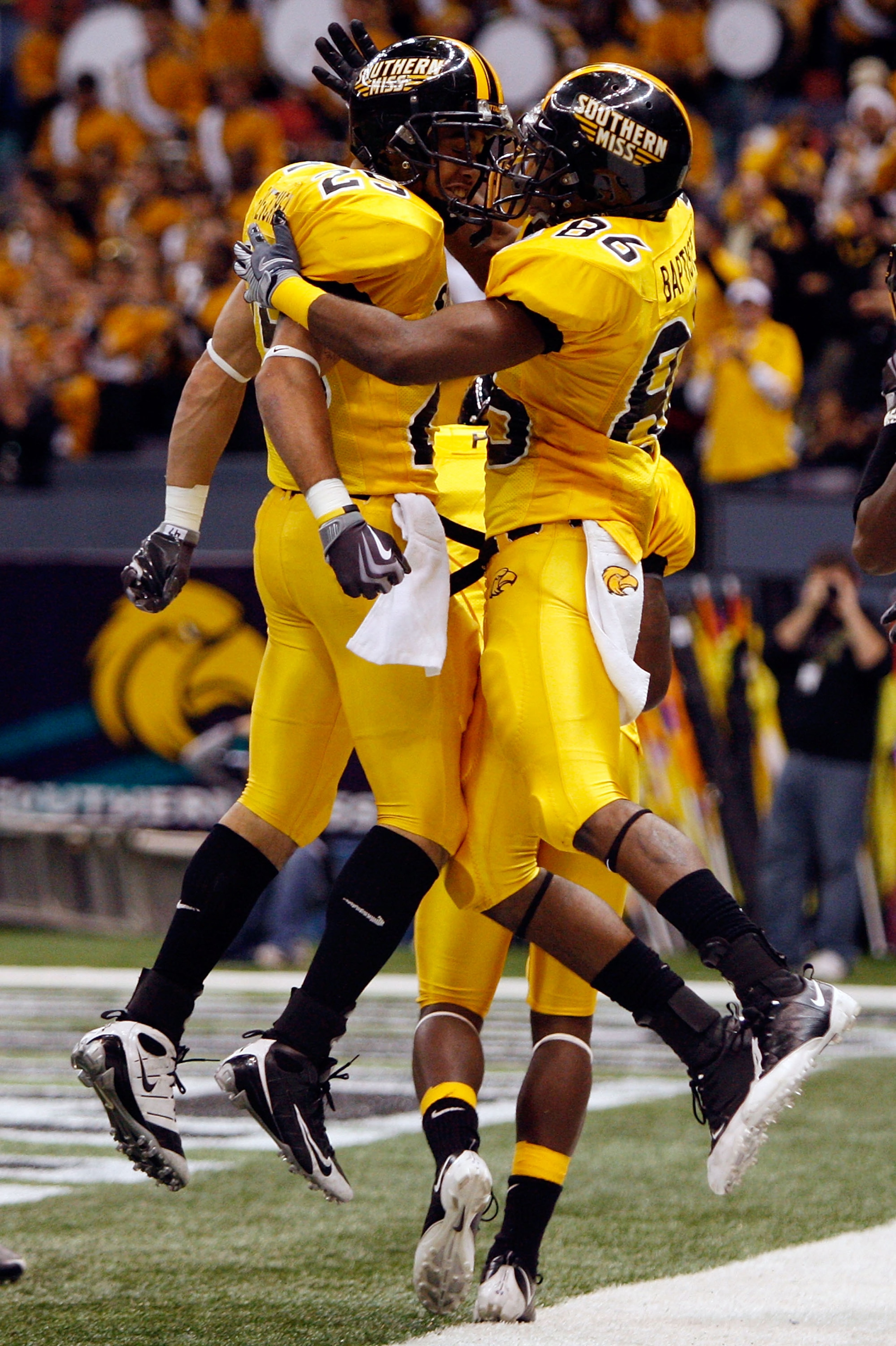 NEW ORLEANS - DECEMBER 21: Damion Fletcher #25 and Gerald Baptiste #86 of the Southern Mississippi Golden Eagles celebrate after Baptiste scored on a 64 yard pass against the Troy Trojans on during the R+L Carriers New Orleans Bowl on December 21, 2008 a NEW ORLEANS - DECEMBER 21: Damion Fletcher #25 and Gerald Baptiste #86 of the Southern Mississippi Golden Eagles celebrate after Baptiste scored on a 64 yard pass against the Troy Trojans on during the R+L Carriers New Orleans Bowl on December 21, 2008 a