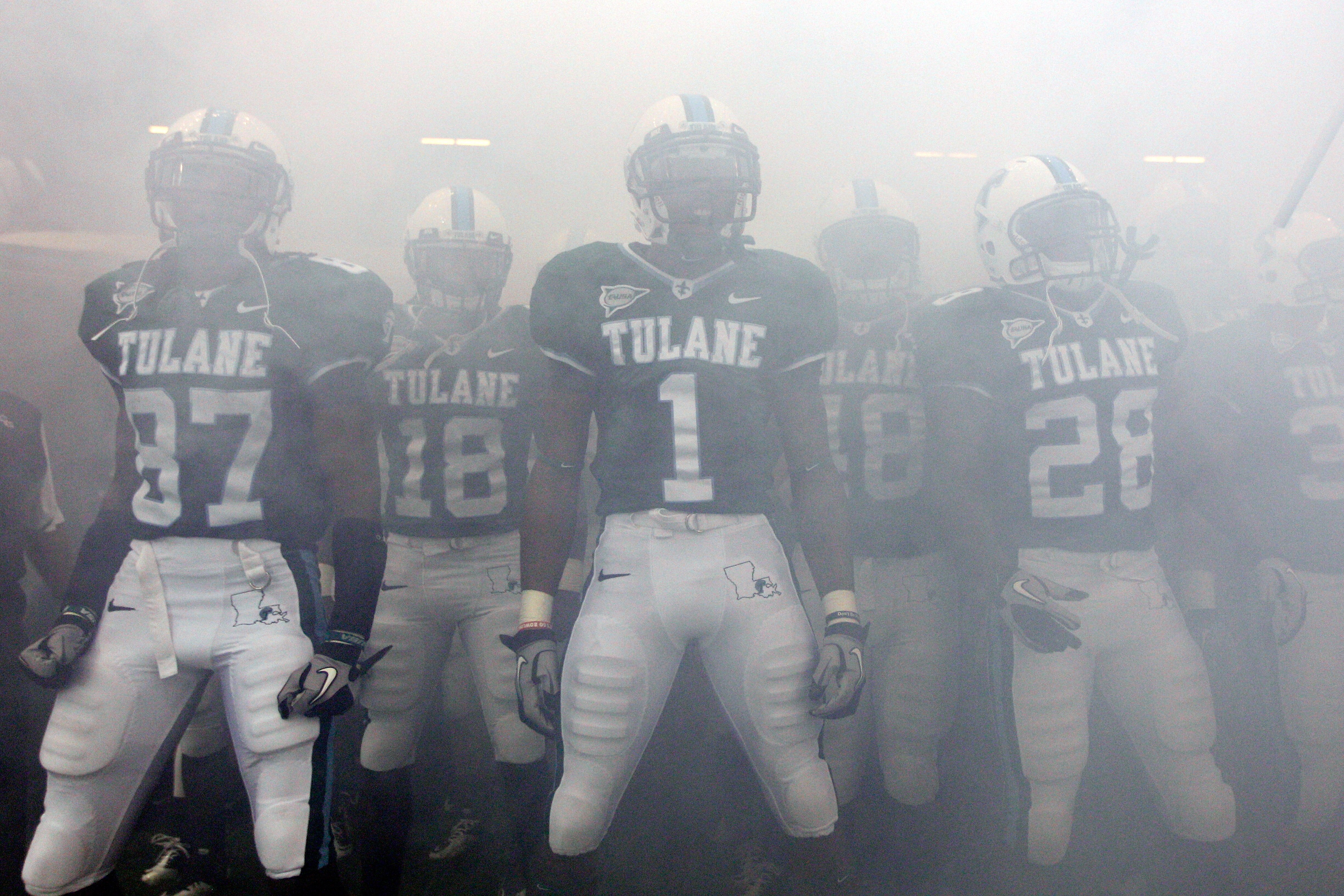 NEW ORLEANS - SEPTEMBER 11:  Members of the Tulane Green Wave take the field before playing the Ole Miss Rebels at the Louisiana Superdome on September 11, 2010 in New Orleans, Louisiana.  (Photo by Chris Graythen/Getty Images)