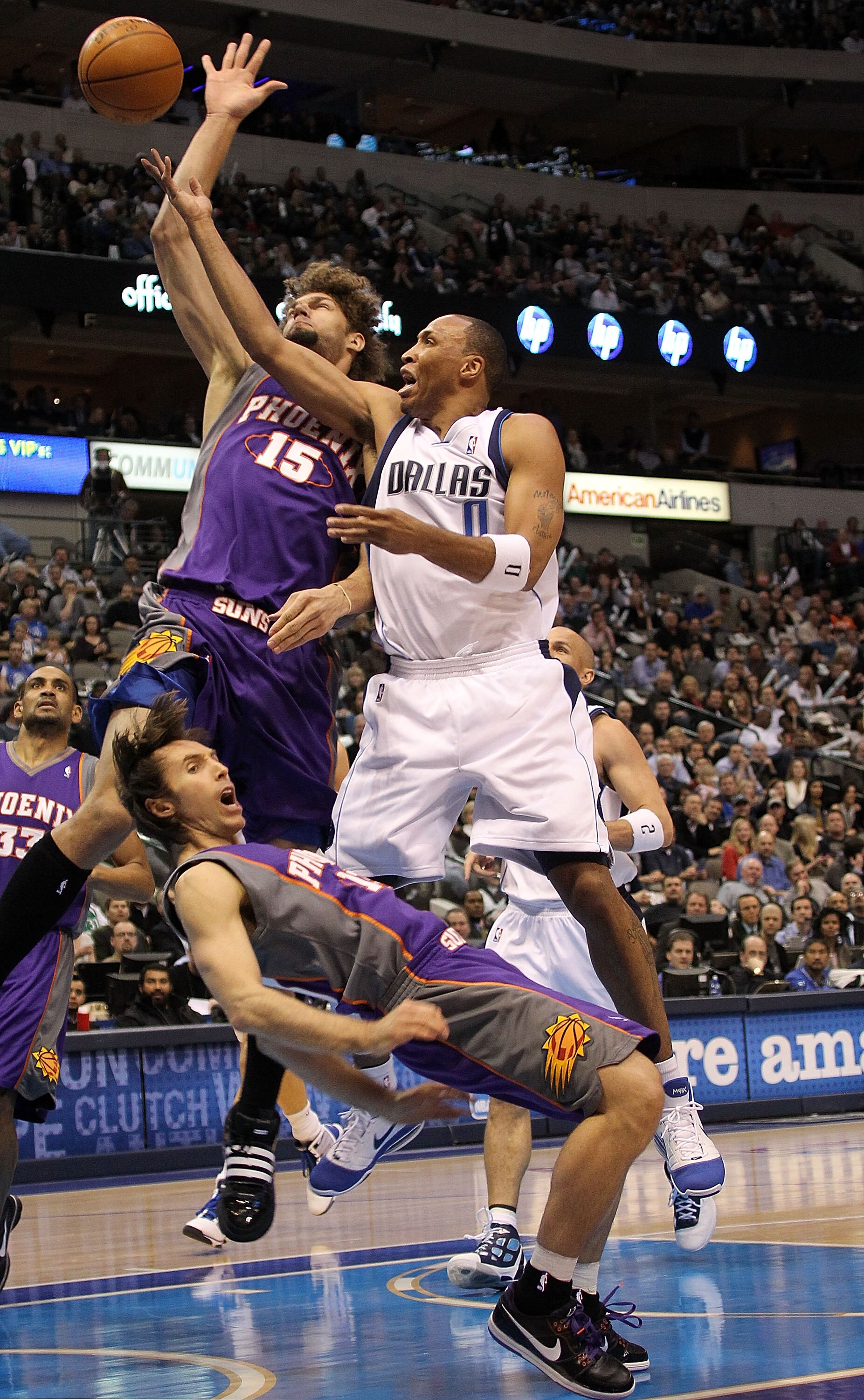 DALLAS - FEBRUARY 17:   Forward Shawn Marion #0 of the Dallas Mavericks fouls Steve Nash #13 of the Phoenix Suns on February 17, 2010 at American Airlines Center in Dallas, Texas.  NOTE TO USER: User expressly acknowledges and agrees that, by downloading