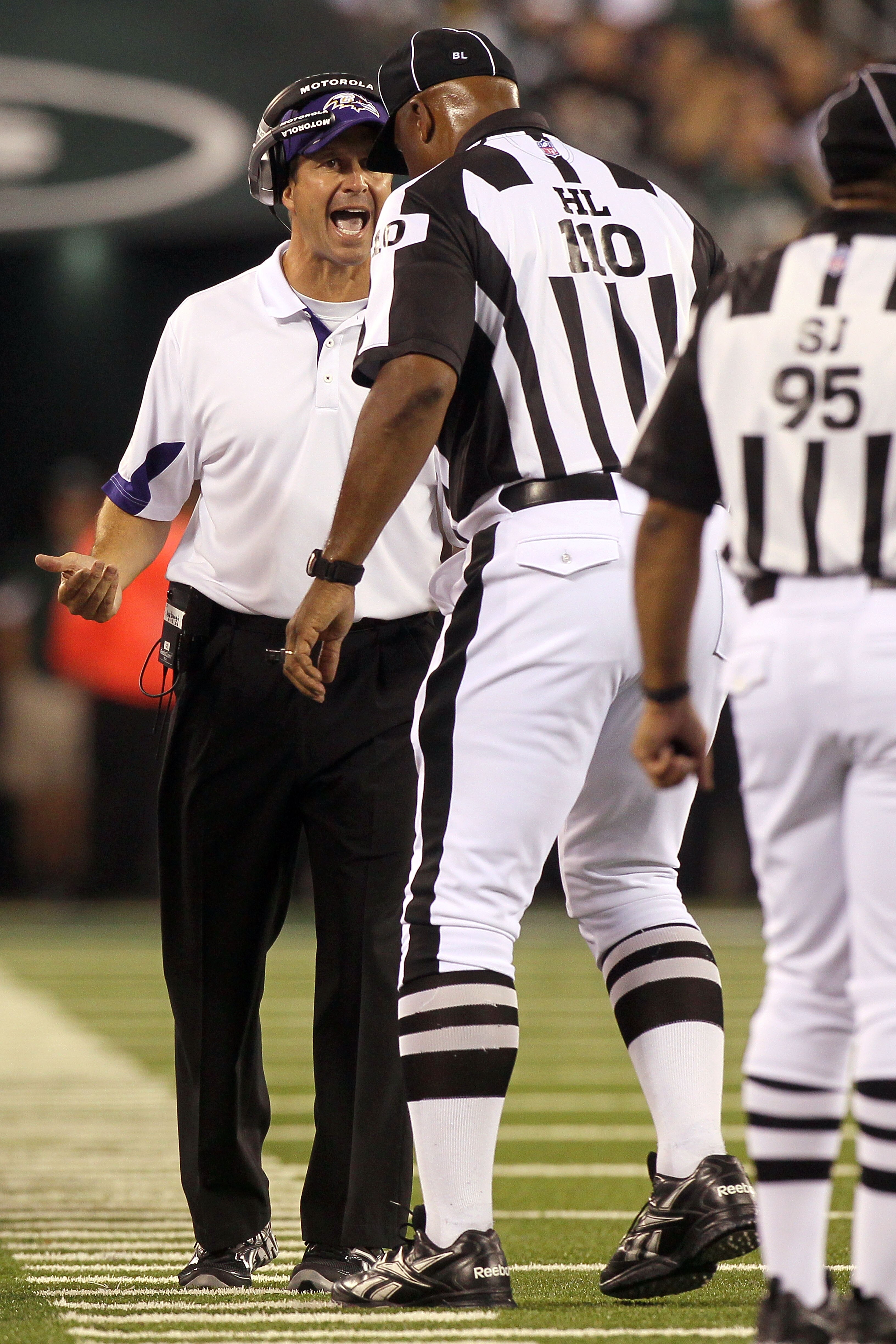 EAST RUTHERFORD, NJ - SEPTEMBER 13:  Head coach John Harbaugh of the Baltimore Ravens stands on the field during their game against the New York Jets at the New Meadowlands Stadium on September 13, 2010 in East Rutherford, New Jersey.  (Photo by Jim McIsa