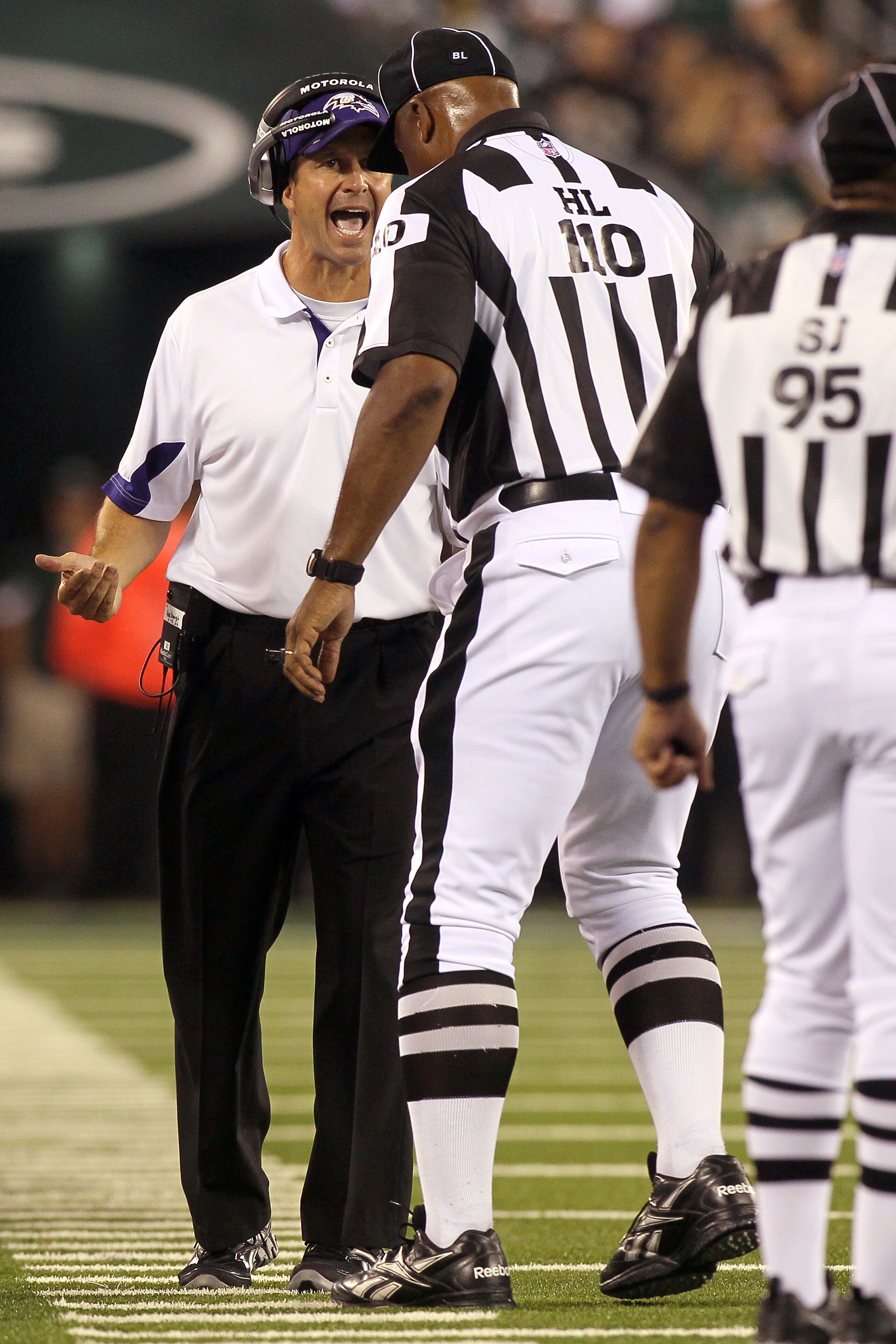 EAST RUTHERFORD, NJ - SEPTEMBER 13:  Head coach John Harbaugh of the Baltimore Ravens stands on the field during their game against the New York Jets at the New Meadowlands Stadium on September 13, 2010 in East Rutherford, New Jersey.  (Photo by Jim McIsa
