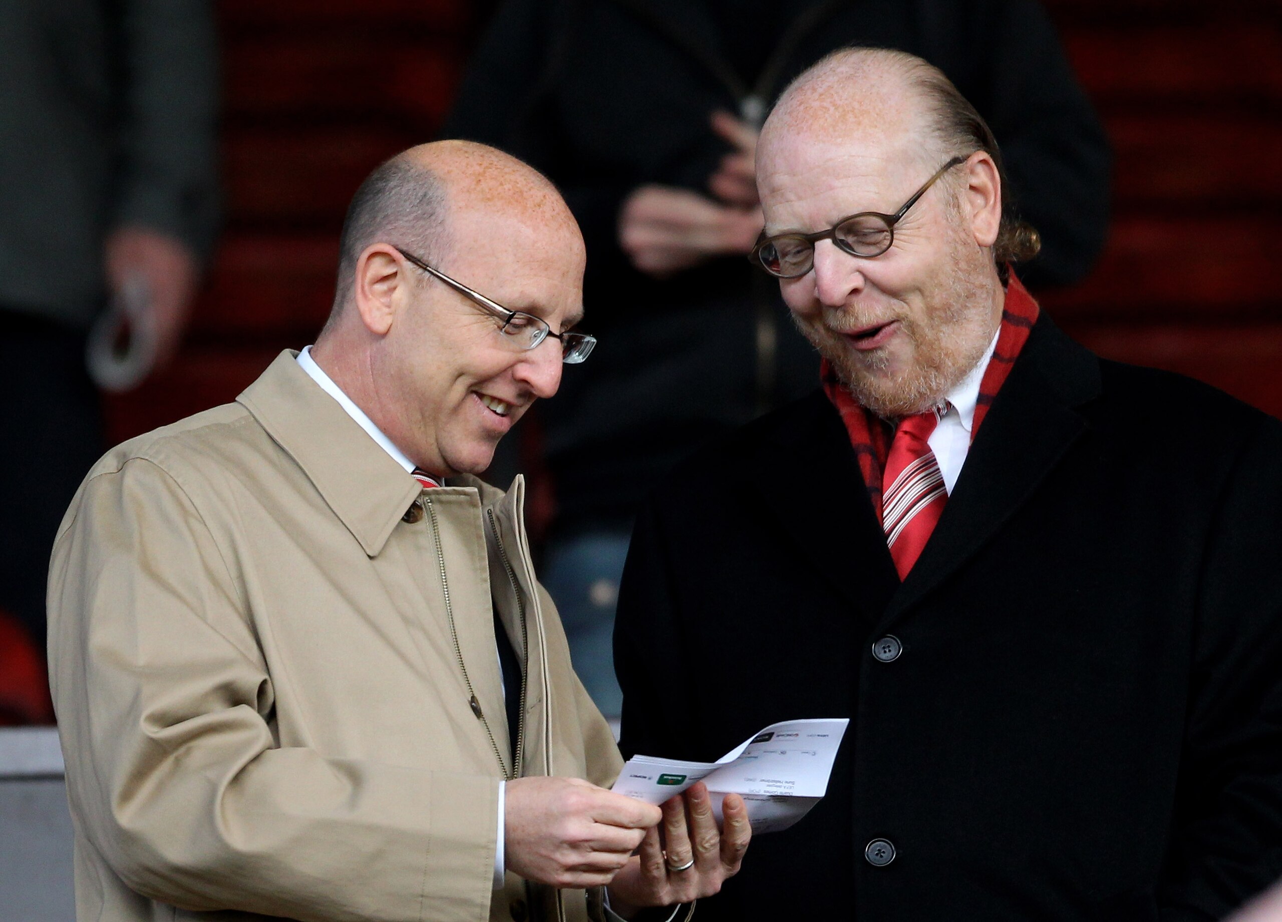 MANCHESTER, ENGLAND - APRIL 12:  Manchester United Directors Joel and Avram Glazer (R) check the team sheet prior to the UEFA Champions League Quarter Final second leg match between Manchester United and Chelsea at Old Trafford on April 12, 2011 in Manche