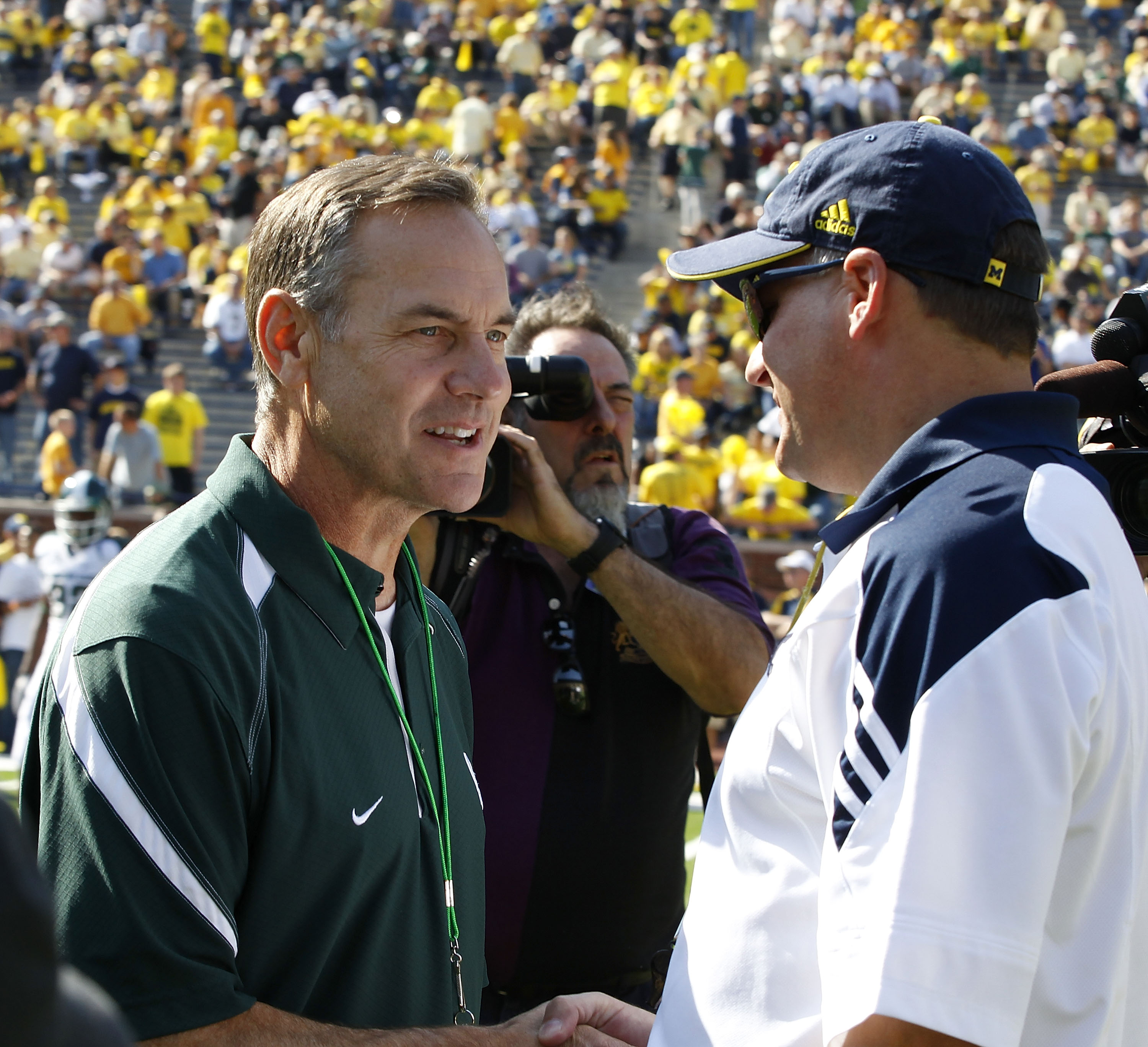 ANN ARBOR, MI - OCTOBER 09: Michigan State head coach Mark Dantonio and Michigan head coach Rich Rodriguez meet prior to the start of the game October 9, 2010 at Michigan Stadium in Ann Arbor, Michigan. (Photo by Leon Halip/Getty Images)