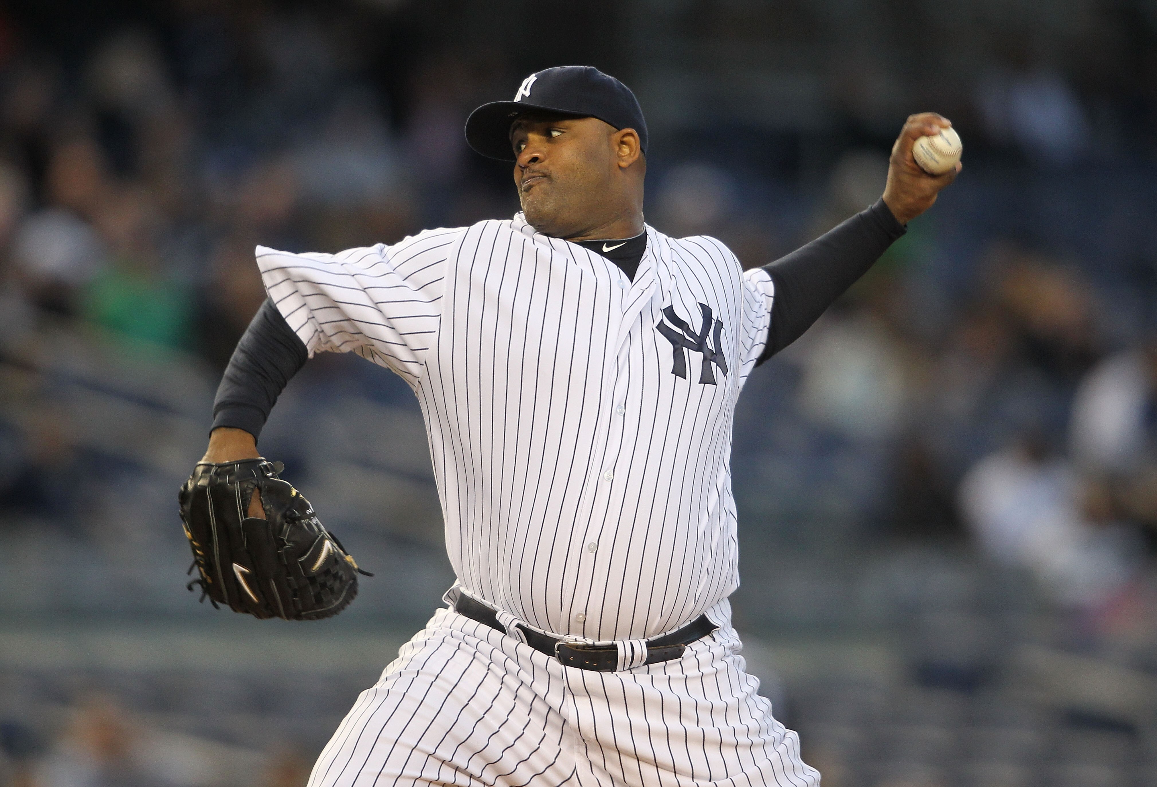 NEW YORK, NY - APRIL 05:  CC Sabathia #52 of the New York Yankees pitches against the Minnesota Twins at Yankee Stadium on April 5, 2011 in the Bronx borough of New York City.  (Photo by Nick Laham/Getty Images)