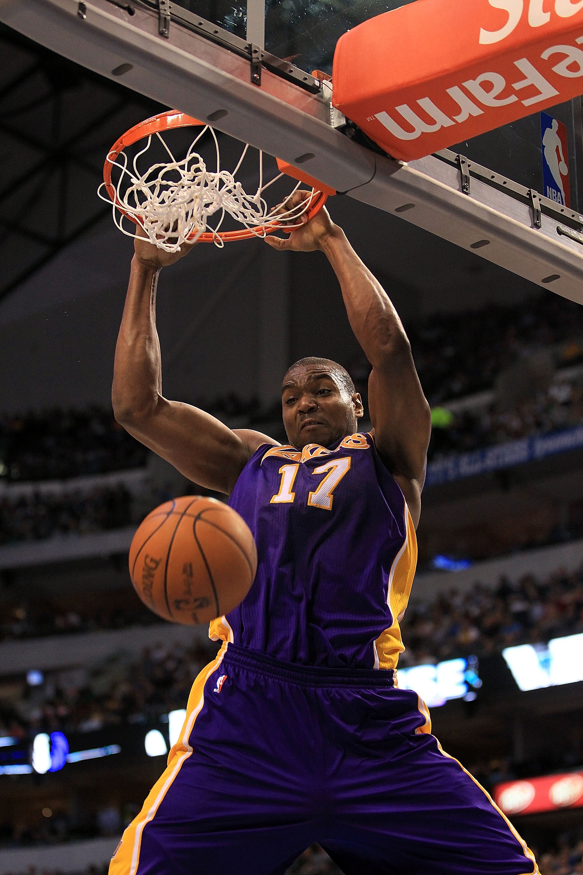 DALLAS, TX - MARCH 12:  Center Andrew Bynum #17 of the Los Angeles Lakers gets the slam dunk against the Dallas Mavericks at American Airlines Center on March 12, 2011 in Dallas, Texas.  NOTE TO USER: User expressly acknowledges and agrees that, by downlo