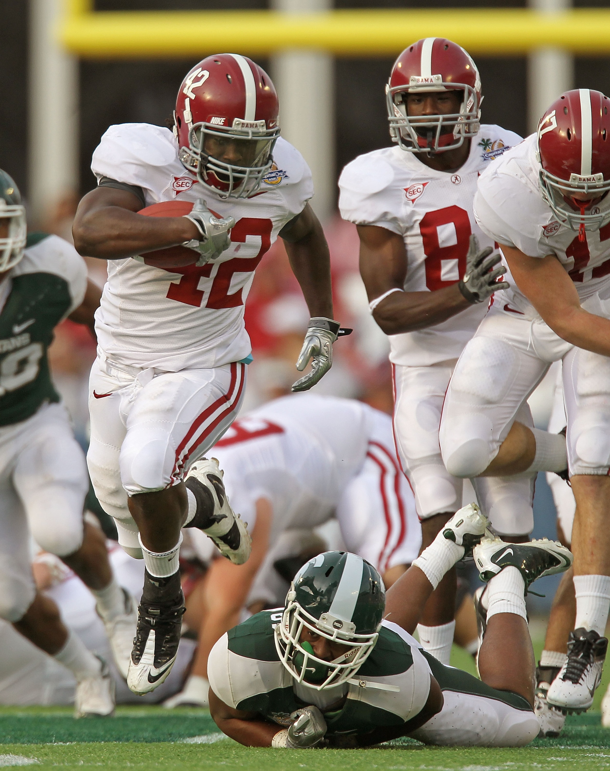 ORLANDO, FL - JANUARY 01: Eddie Lacy #42 of the Alabama Crimson Tide rushes for a touchdown during the Capitol One Bowl against the Michigan State Spartans at the Florida Citrus Bowl on January 1, 2011 in Orlando, Florida. (Photo by Mike Ehrmann/Getty I ORLANDO, FL - JANUARY 01: Eddie Lacy #42 of the Alabama Crimson Tide rushes for a touchdown during the Capitol One Bowl against the Michigan State Spartans at the Florida Citrus Bowl on January 1, 2011 in Orlando, Florida. (Photo by Mike Ehrmann/Getty I