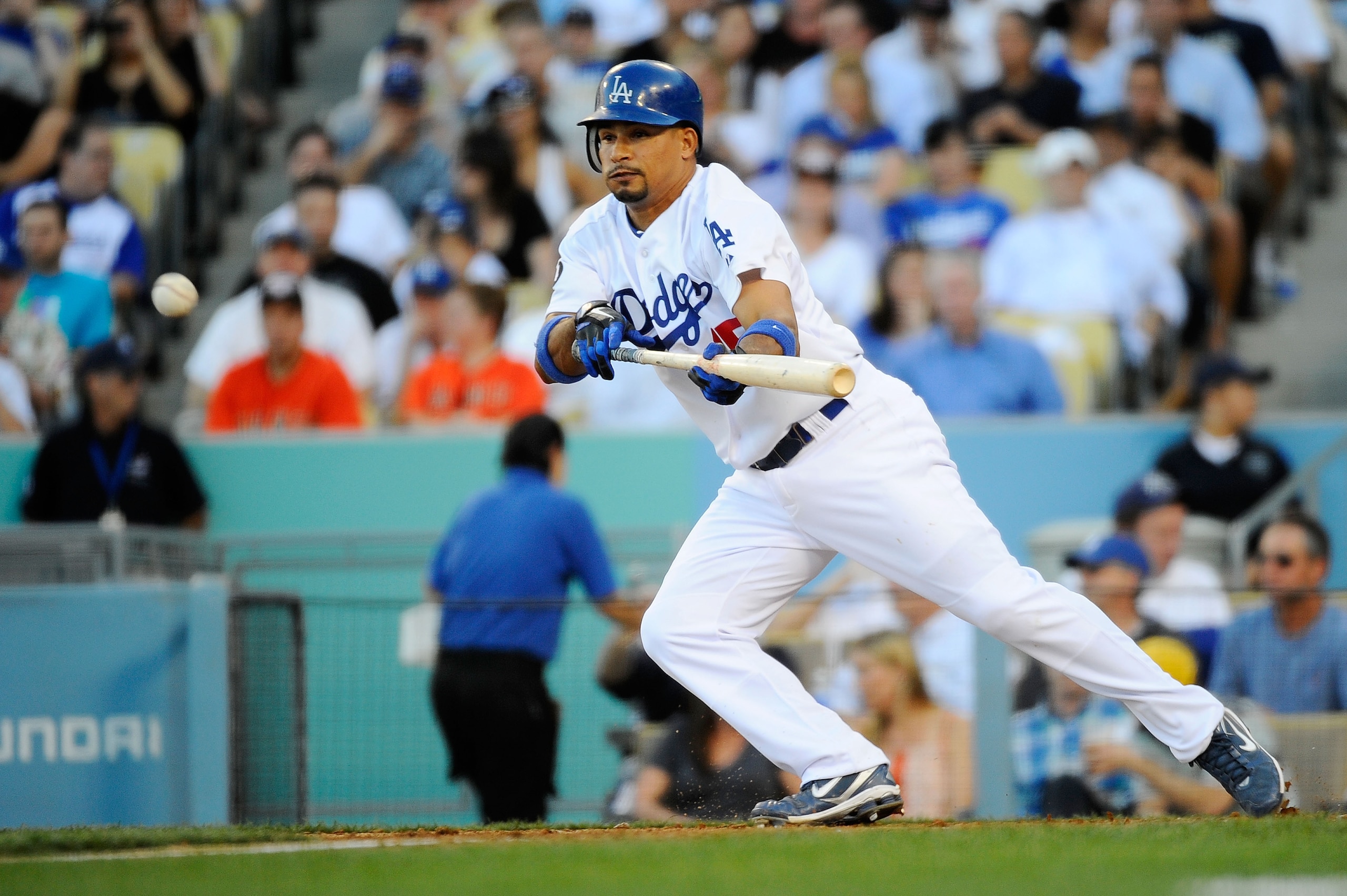 LOS ANGELES, CA - MARCH 31:  Rafael Furcal #15 of the Los Angeles Dodgers bunts the ball against the San Francisco Giants in the third inning on Opening Day at Dodger Stadium on March 31, 2011 in Los Angeles, California.  (Photo by Kevork Djansezian/Getty