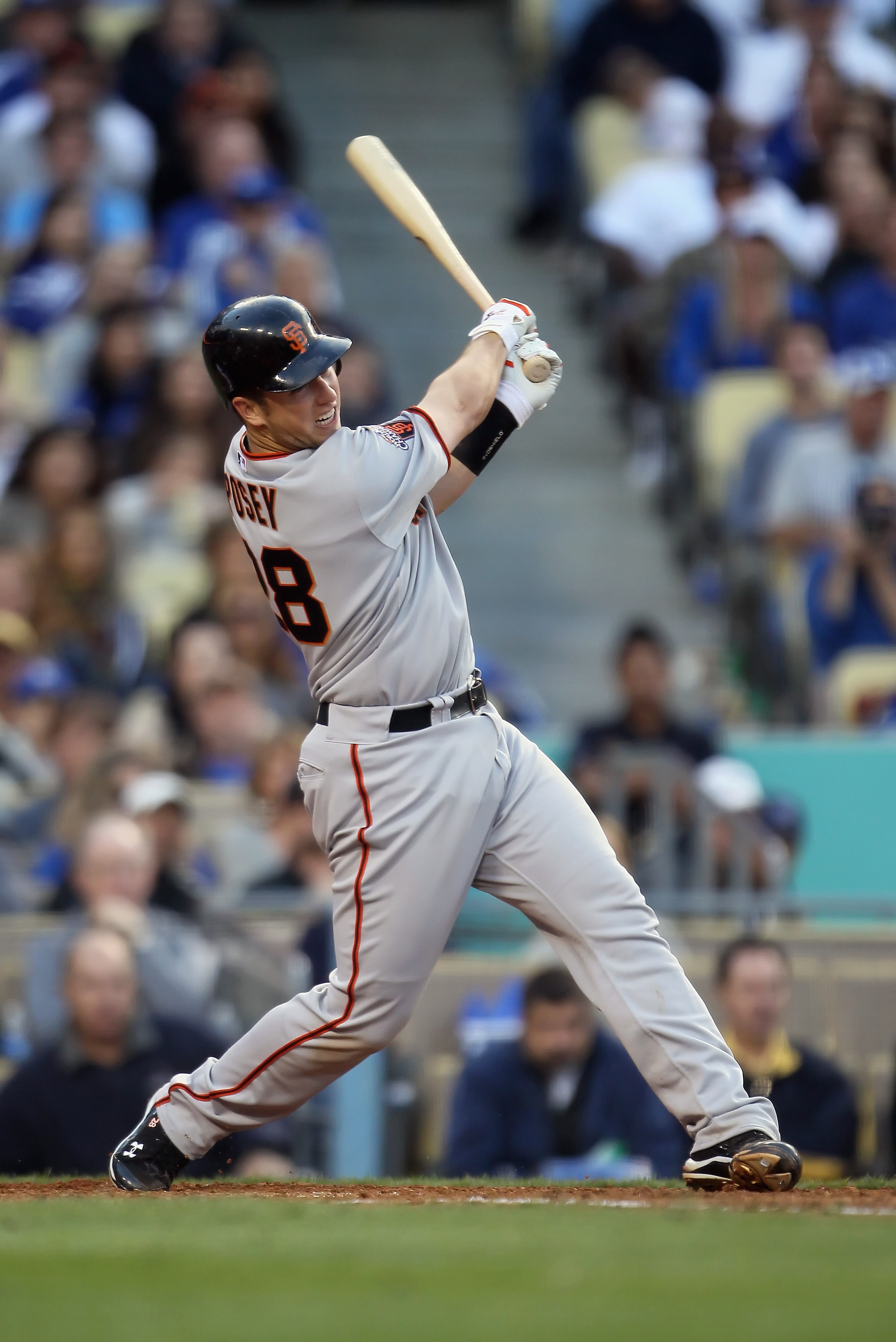 LOS ANGELES, CA - APRIL 03:  Buster Posey #28 of the San Francisco Giants bats against the Los Angeles Dodgers at Dodger Stadium on April 3, 2011 in Los Angeles, California.  (Photo by Jeff Gross/Getty Images)
