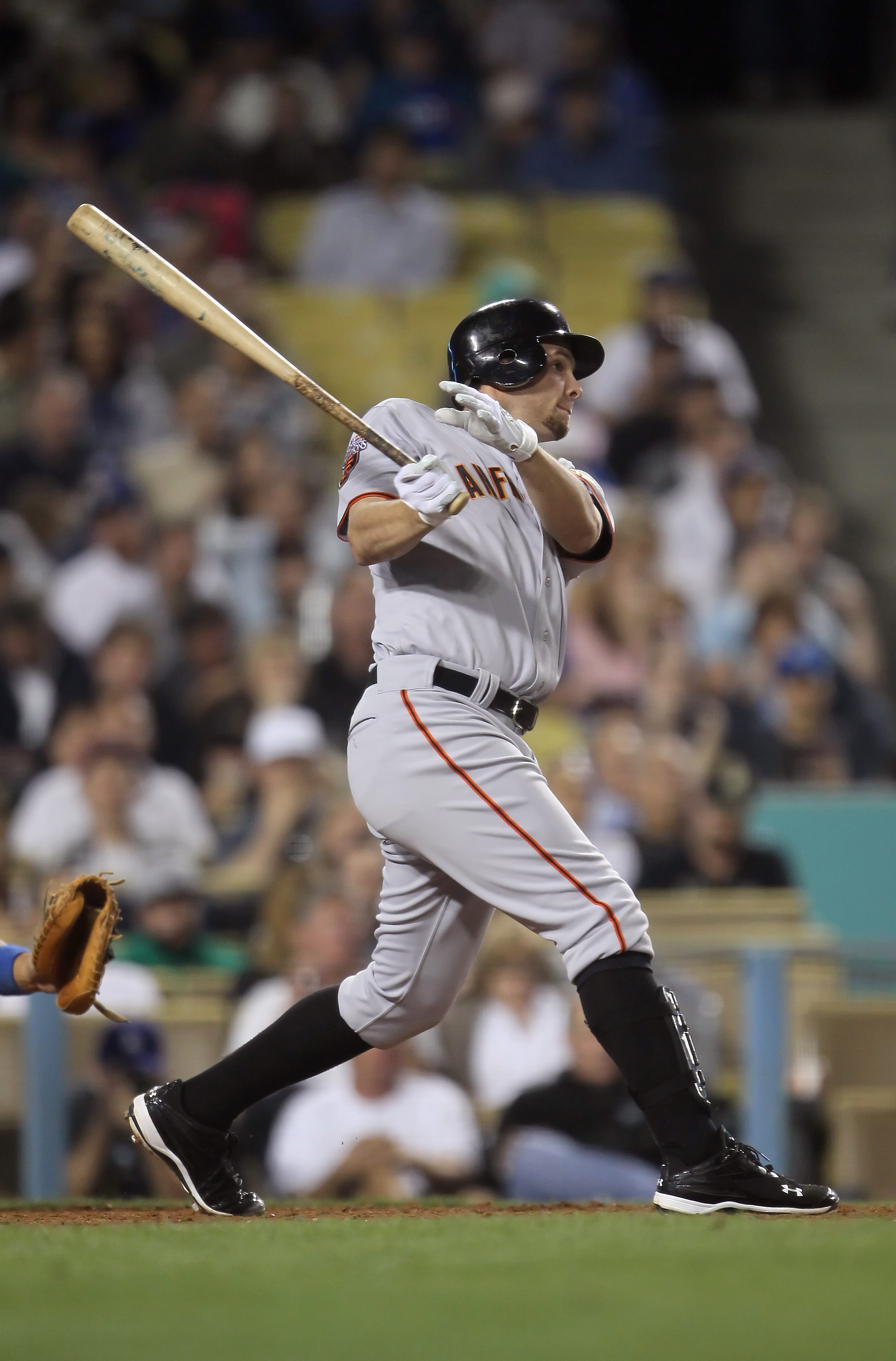 LOS ANGELES, CA - APRIL 01:  Brandon Belt #9 of the San Francisco Giants hits a three-run homerun against the Los Angeles Dodgers in the fourth inning at Dodger Stadium on April 1, 2011 in Los Angeles, California.  (Photo by Jeff Gross/Getty Images)