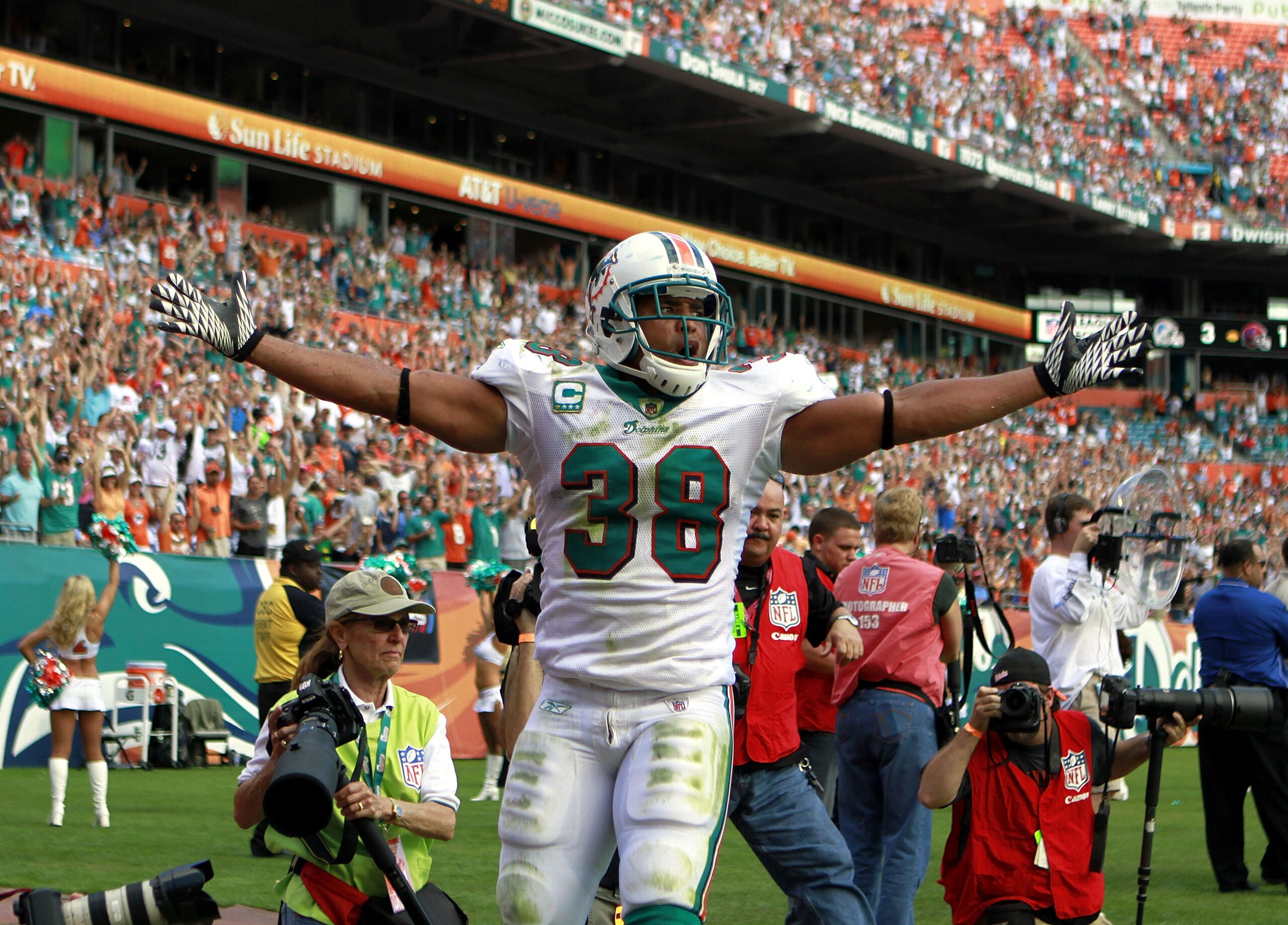 MIAMI - NOVEMBER 14:  Patrick Cobbs #38 of the Miami Dolphins celebrates a touchdown against the Tennessee Titans at Sun Life Stadium on November 14, 2010 in Miami, Florida.  (Photo by Marc Serota/Getty Images)