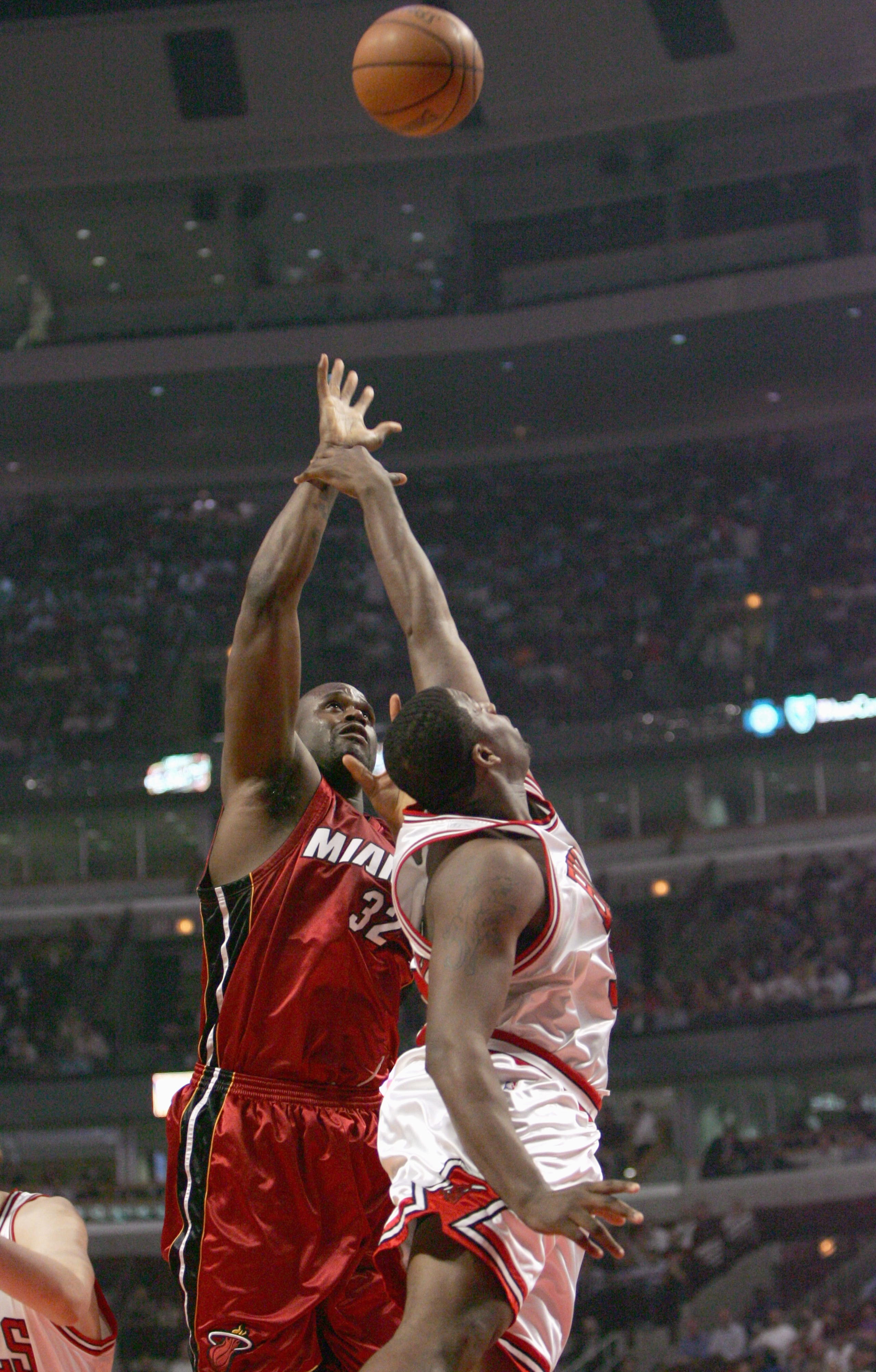 CHICAGO - MAY 4: Shaquille O'Neal #32 of the Miami Heat  puts the ball up against Michael Sweetney #50 of the Chicago Bulls in game six of the Eastern Conference Quarterfinals during the 2006 NBA Playoffs on May 4, 2006 at the United Center in Chicago, Il