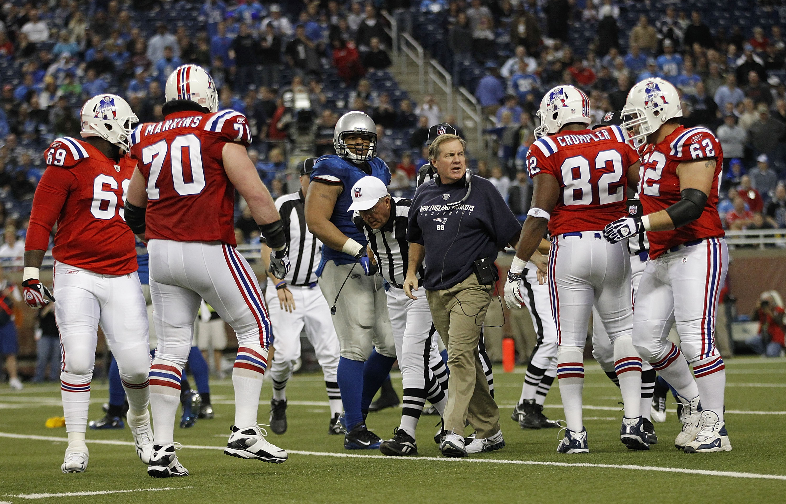 DETROIT - NOVEMBER 25:  New England Patriots head coach Bill Belichick breaks up a late fourth quarter scuffle between the Lions and the Patriots during the game at Ford Field on November 25, 2010 in Detroit, Michigan. New England defeated Detroit 45-24.