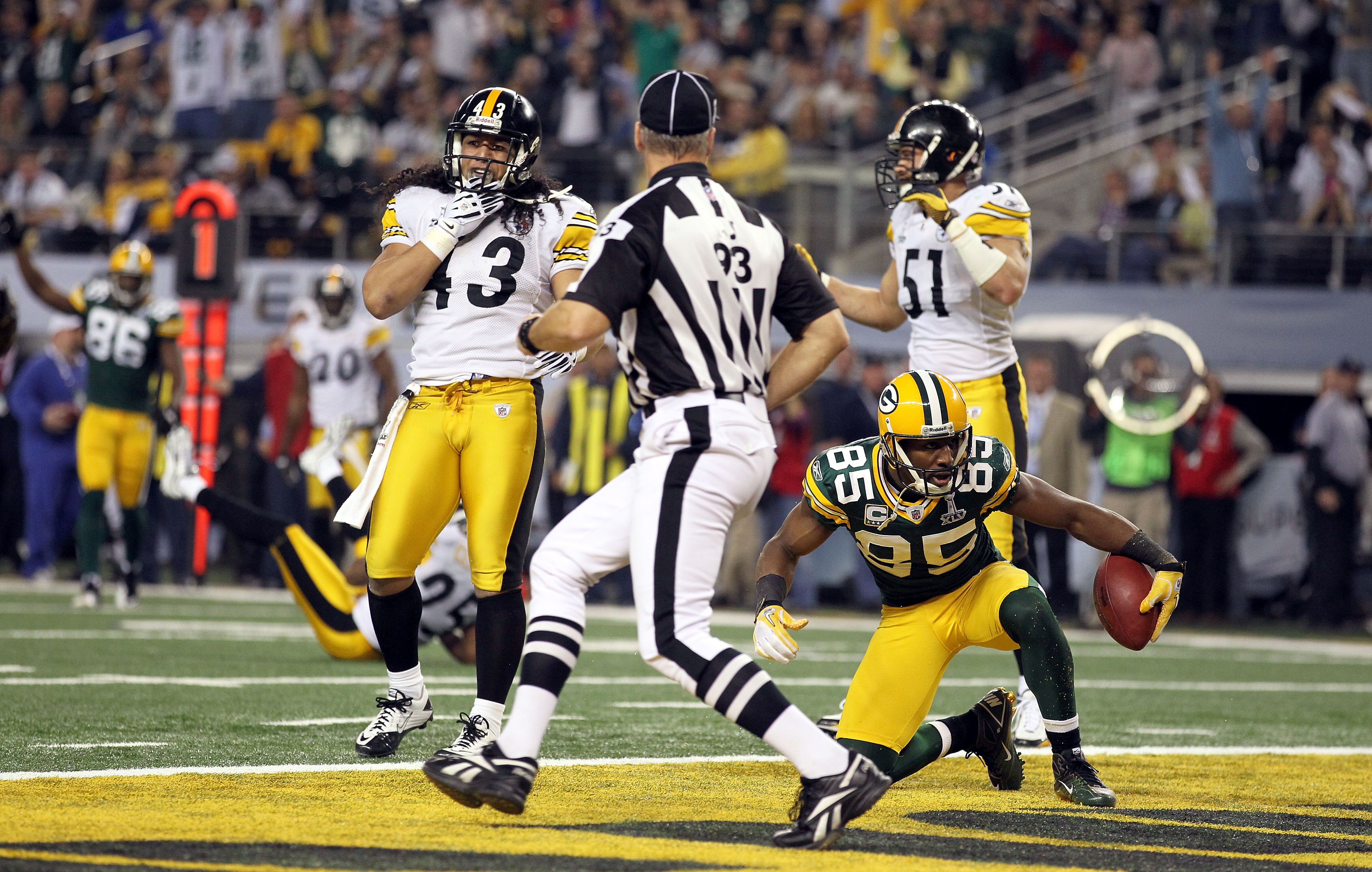 ARLINGTON, TX - FEBRUARY 06:  Greg Jennings #85 of the Green Bay Packers reacts after catching a 21 yard pass for a touchdown against Troy Polamalu #43 and James Farrior #51 of the Pittsburgh Steelers during Super Bowl XLV at Cowboys Stadium on February 6