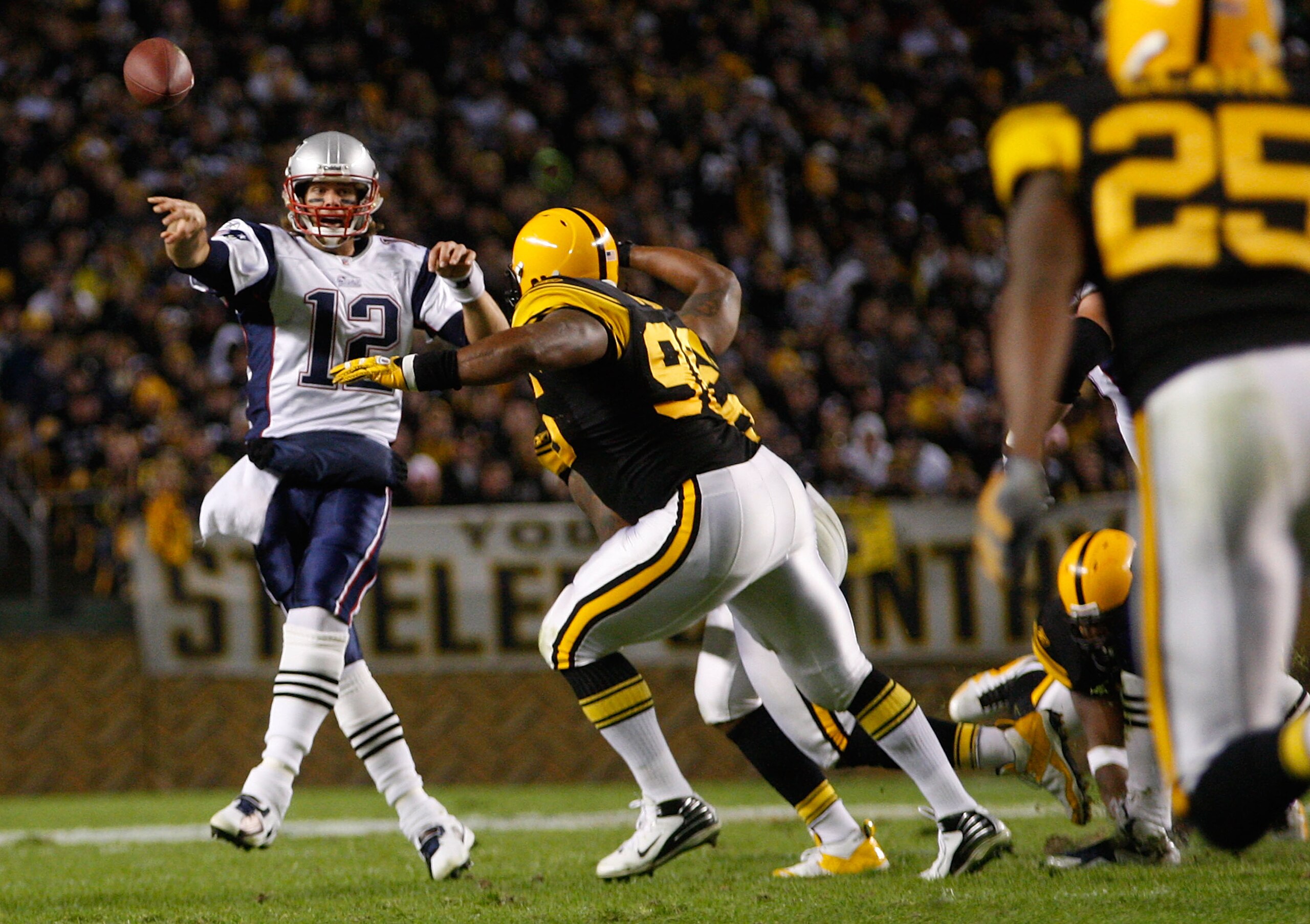 PITTSBURGH, PA - NOVEMBER 14: Tom Brady #12 of the New England Patriots throws a pass around the Pittsburgh Steelers defense during the game on November 14, 2010 at Heinz Field in Pittsburgh, Pennsylvania. (Photo by Jared Wickerham/Getty Images) PITTSBURGH, PA - NOVEMBER 14: Tom Brady #12 of the New England Patriots throws a pass around the Pittsburgh Steelers defense during the game on November 14, 2010 at Heinz Field in Pittsburgh, Pennsylvania. (Photo by Jared Wickerham/Getty Images)