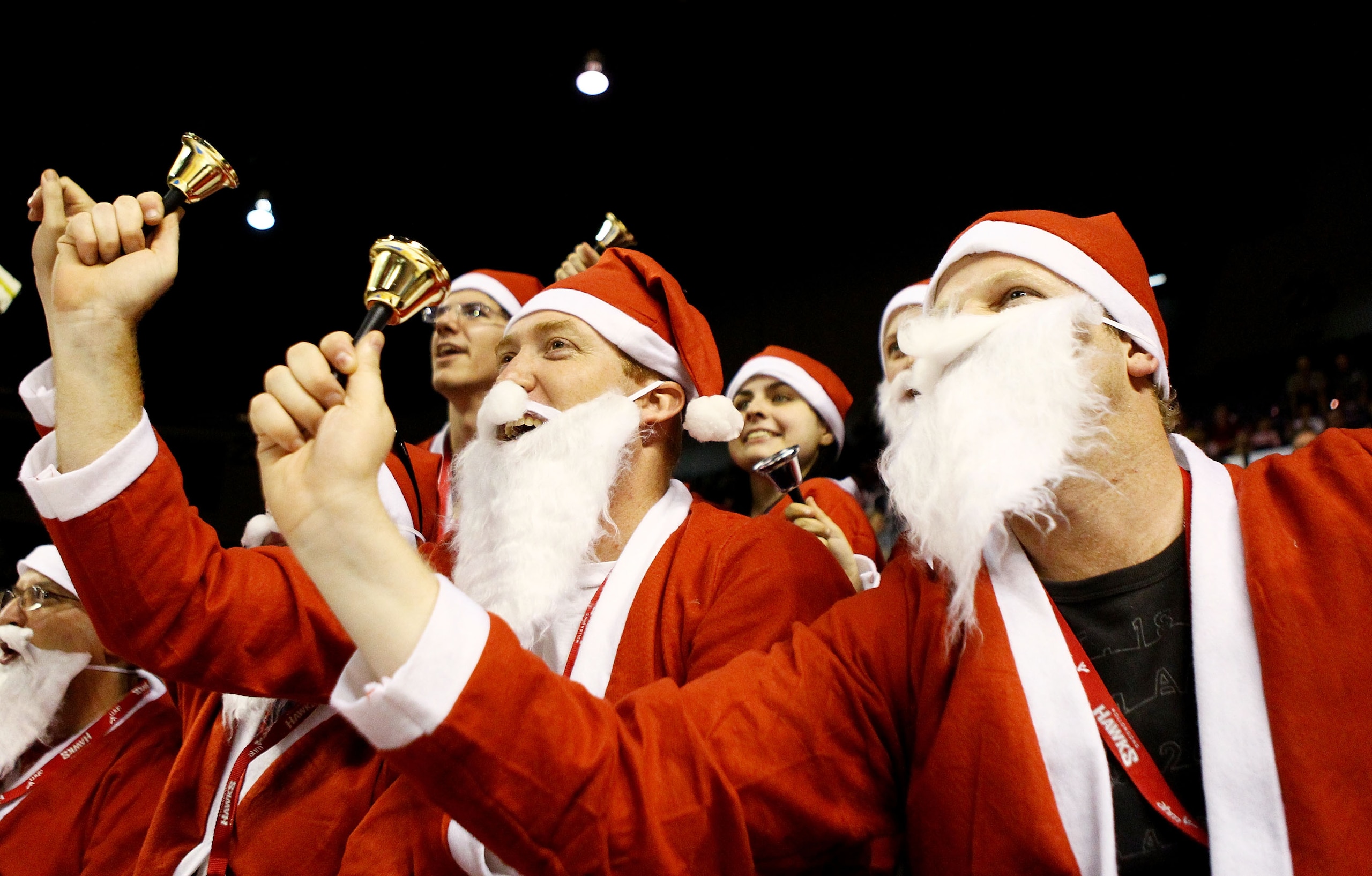 WOLLONGONG, AUSTRALIA - DECEMBER 23: Hawks fans dressed as Santa Claus cheer during the round 11 NBL match between the Wollongong Hawks and the Gold Coast Blaze at Wollongong Entertainment Centre on December 23, 2010 in Wollongong, Australia. (Photo by WOLLONGONG, AUSTRALIA - DECEMBER 23: Hawks fans dressed as Santa Claus cheer during the round 11 NBL match between the Wollongong Hawks and the Gold Coast Blaze at Wollongong Entertainment Centre on December 23, 2010 in Wollongong, Australia. (Photo by