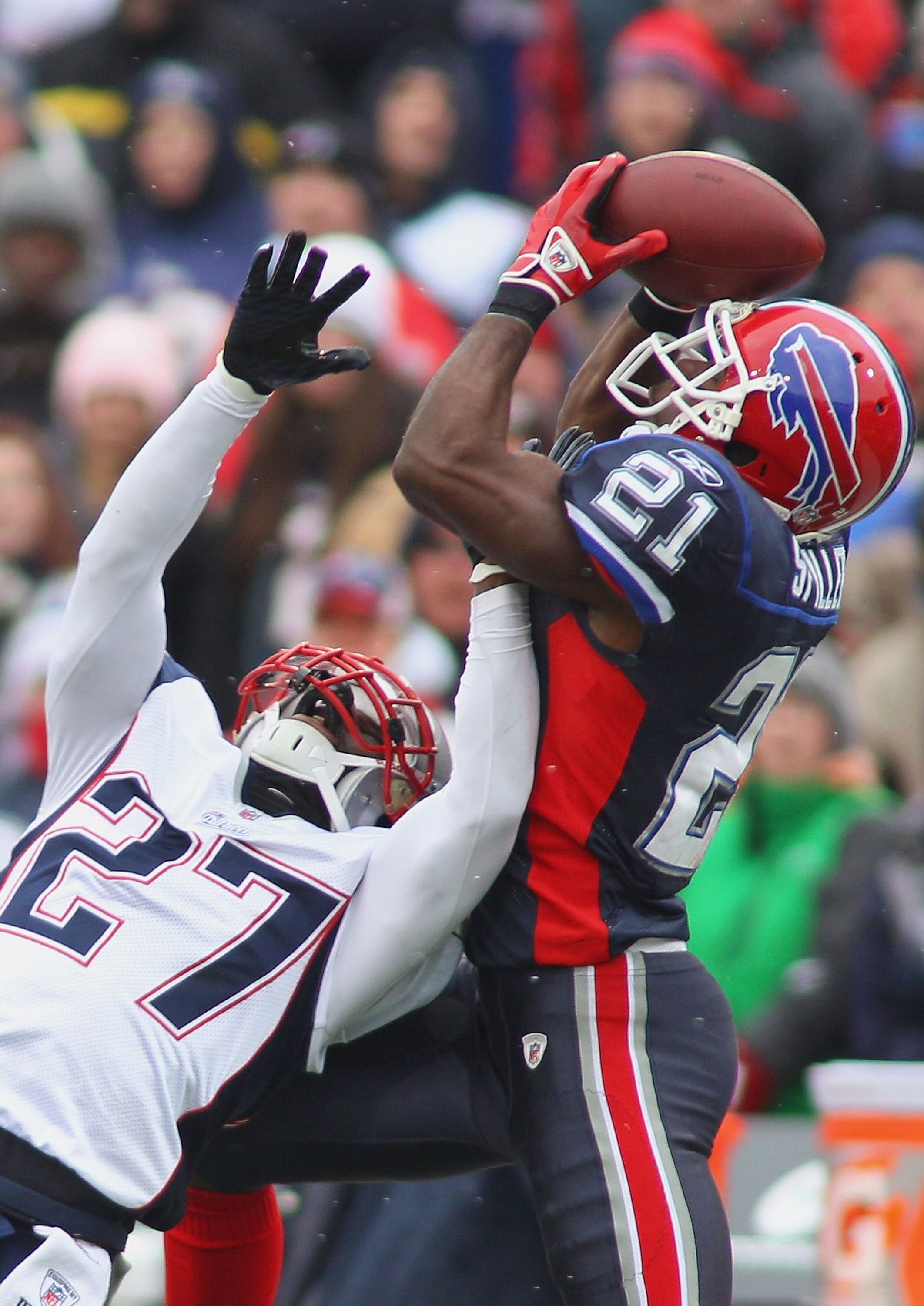 ORCHARD PARK, NY - DECEMBER 26:  C.J. Spiller #21  of the Buffalo Bills makes a catch against Kyle Arrington #27 of the New England Patriots at Ralph Wilson Stadium on December 26, 2010 in Orchard Park, New York. New England won 34-3. (Photo by Rick Stewa