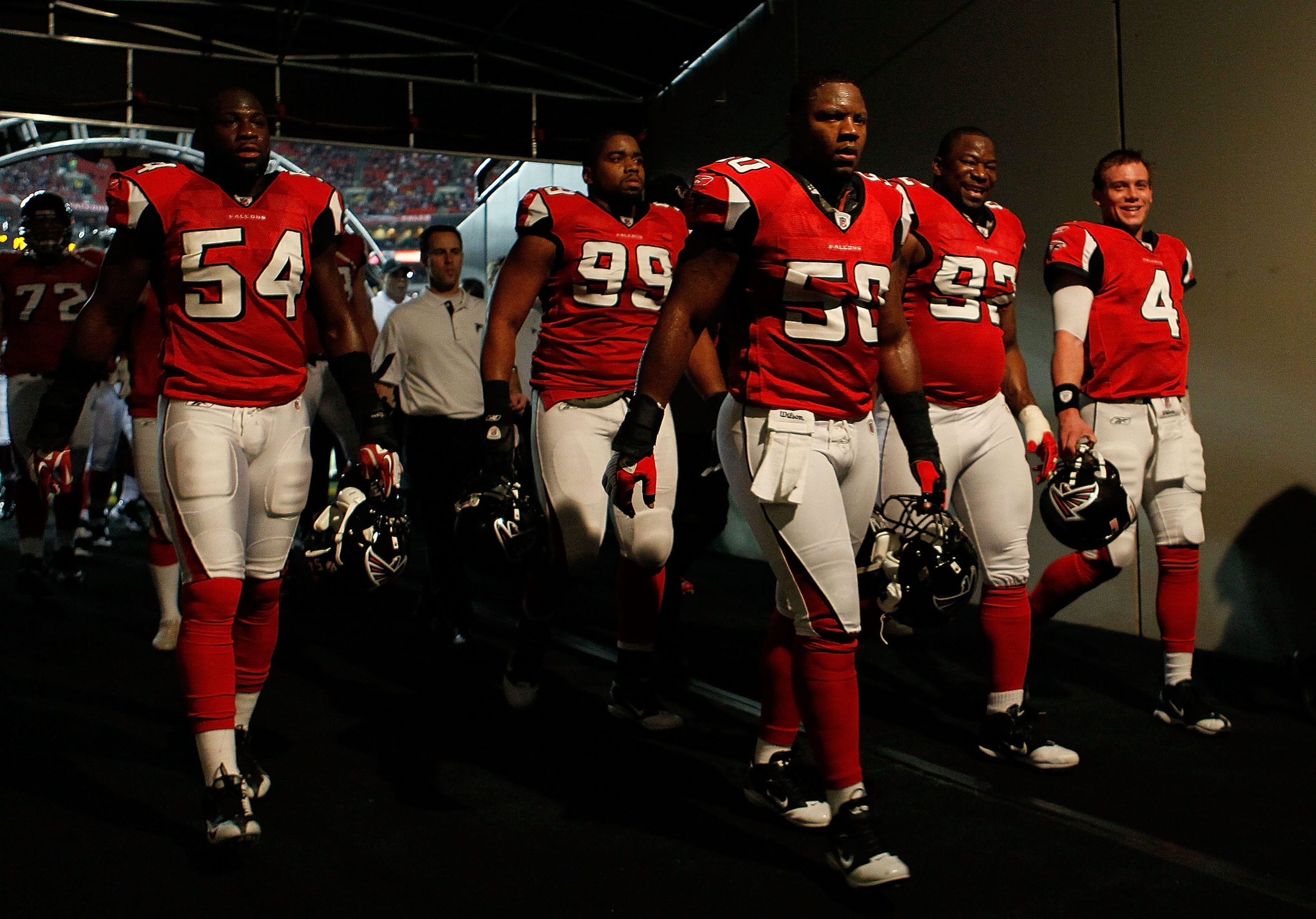 ATLANTA, GA - JANUARY 15: Curtis Lofton #50, Stephen Nicholas #54 and Vance Walker #99 of the Atlanta Falcons walk back to the locker room after warm ups against the Green Bay Packers during their 2011 NFC divisional playoff game at Georgia Dome on Janua ATLANTA, GA - JANUARY 15: Curtis Lofton #50, Stephen Nicholas #54 and Vance Walker #99 of the Atlanta Falcons walk back to the locker room after warm ups against the Green Bay Packers during their 2011 NFC divisional playoff game at Georgia Dome on Janua