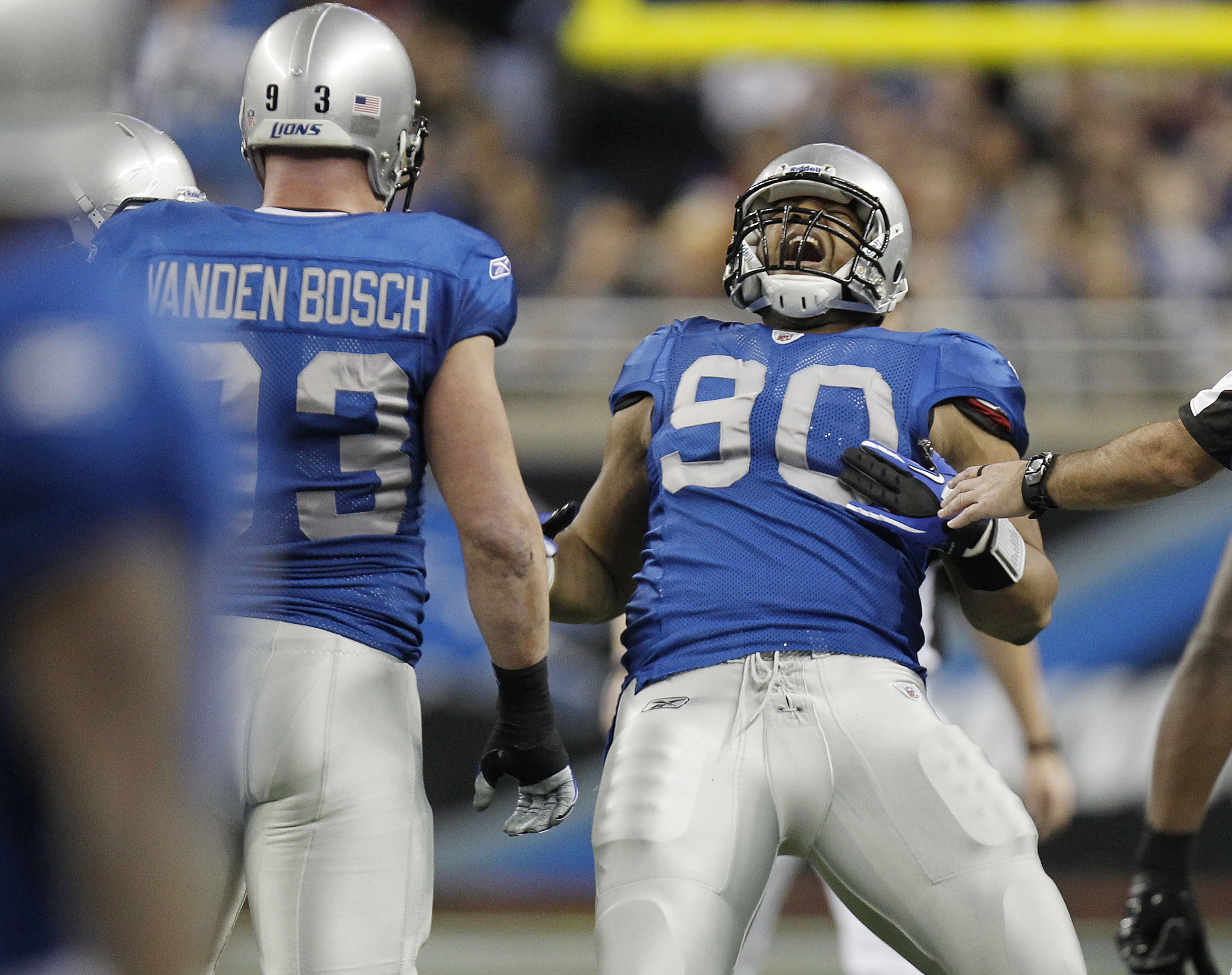 DETROIT - NOVEMBER 25:  Ndamukong Suh #90 of the Detroit Lions celebrates a first quarter sack next to Kyle Vanden Bosch #93 while playing the New England Patriots on November 25, 2010 at Ford Field in Detroit, Michigan.  (Photo by Gregory Shamus/Getty Im