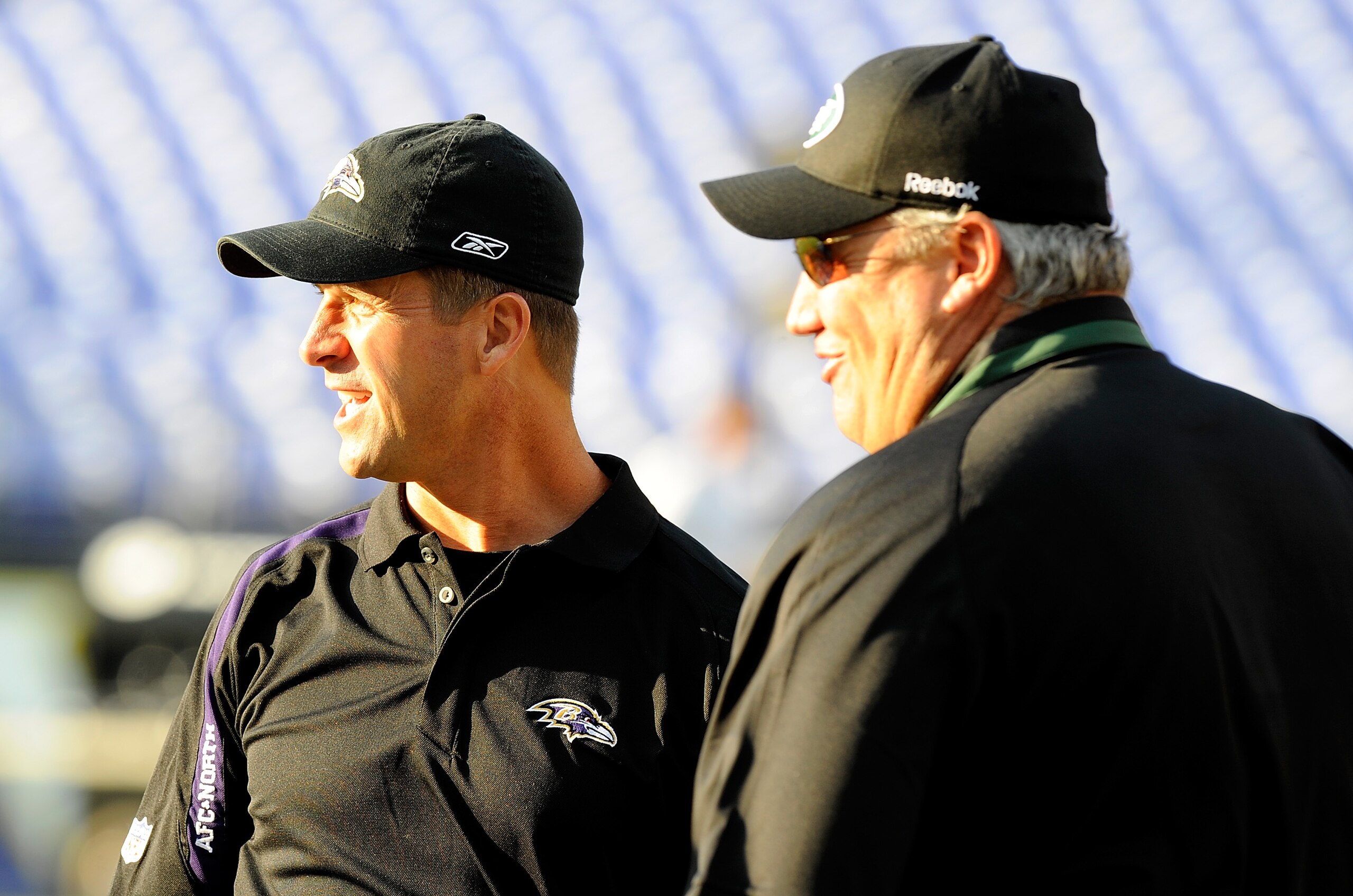 BALTIMORE - AUGUST 24:  Head coach Rex Ryan (R) of the New York Jets talks with head coach John Harbaugh (L) of the Baltimore Ravens before the game at M&T Bank Stadium on August 24, 2009 in Baltimore, Maryland.  (Photo by Greg Fiume/Getty Images)