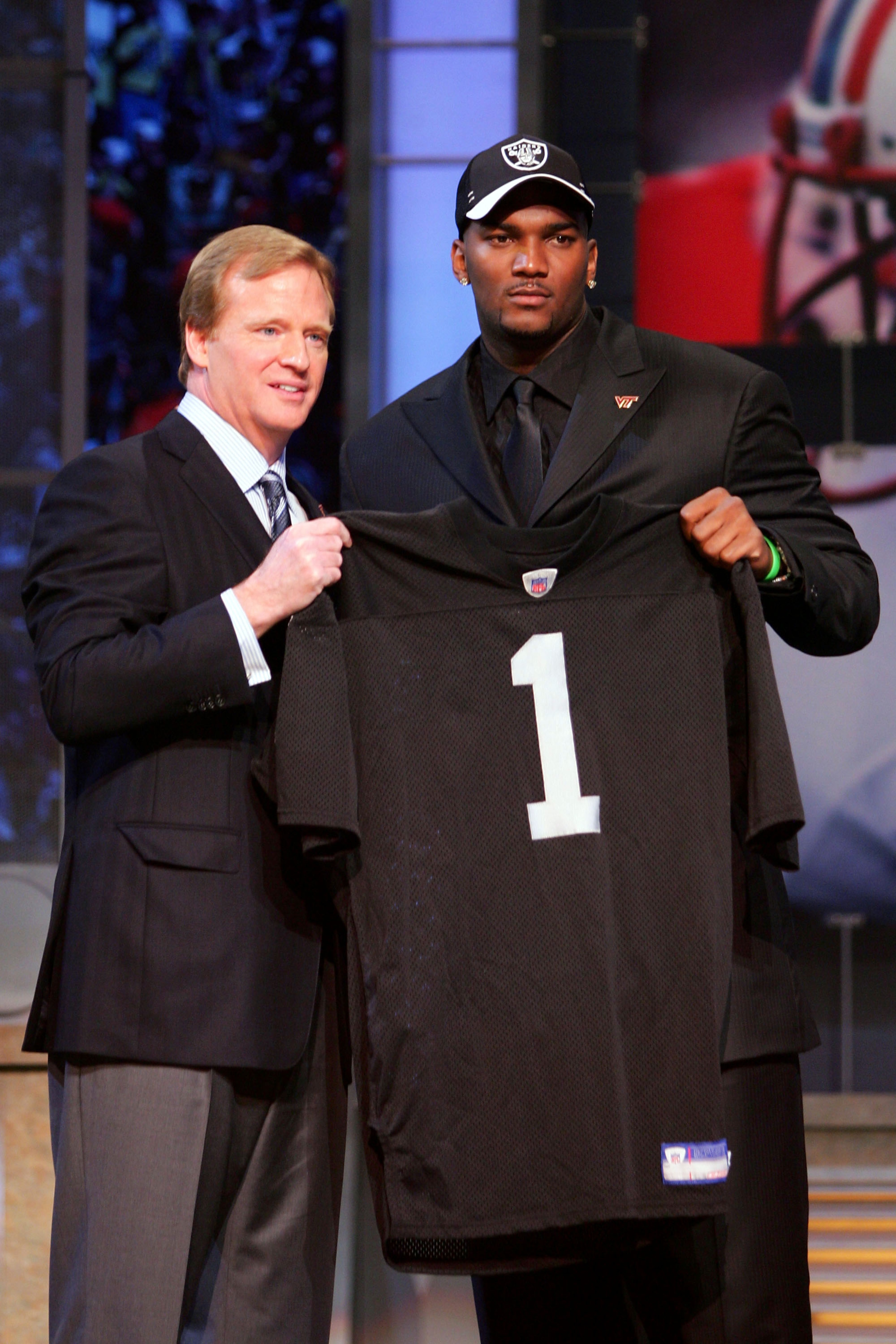 NEW YORK - APRIL 28: Quarterback JaMarcus Russell of Louisiana State University poses for a photo with NFL Commisioner Roger Goodell after being drafted first overall by the Oakland Raiders during the 2007 NFL Draft on April 28, 2007 at Radio City Music NEW YORK - APRIL 28: Quarterback JaMarcus Russell of Louisiana State University poses for a photo with NFL Commisioner Roger Goodell after being drafted first overall by the Oakland Raiders during the 2007 NFL Draft on April 28, 2007 at Radio City Music