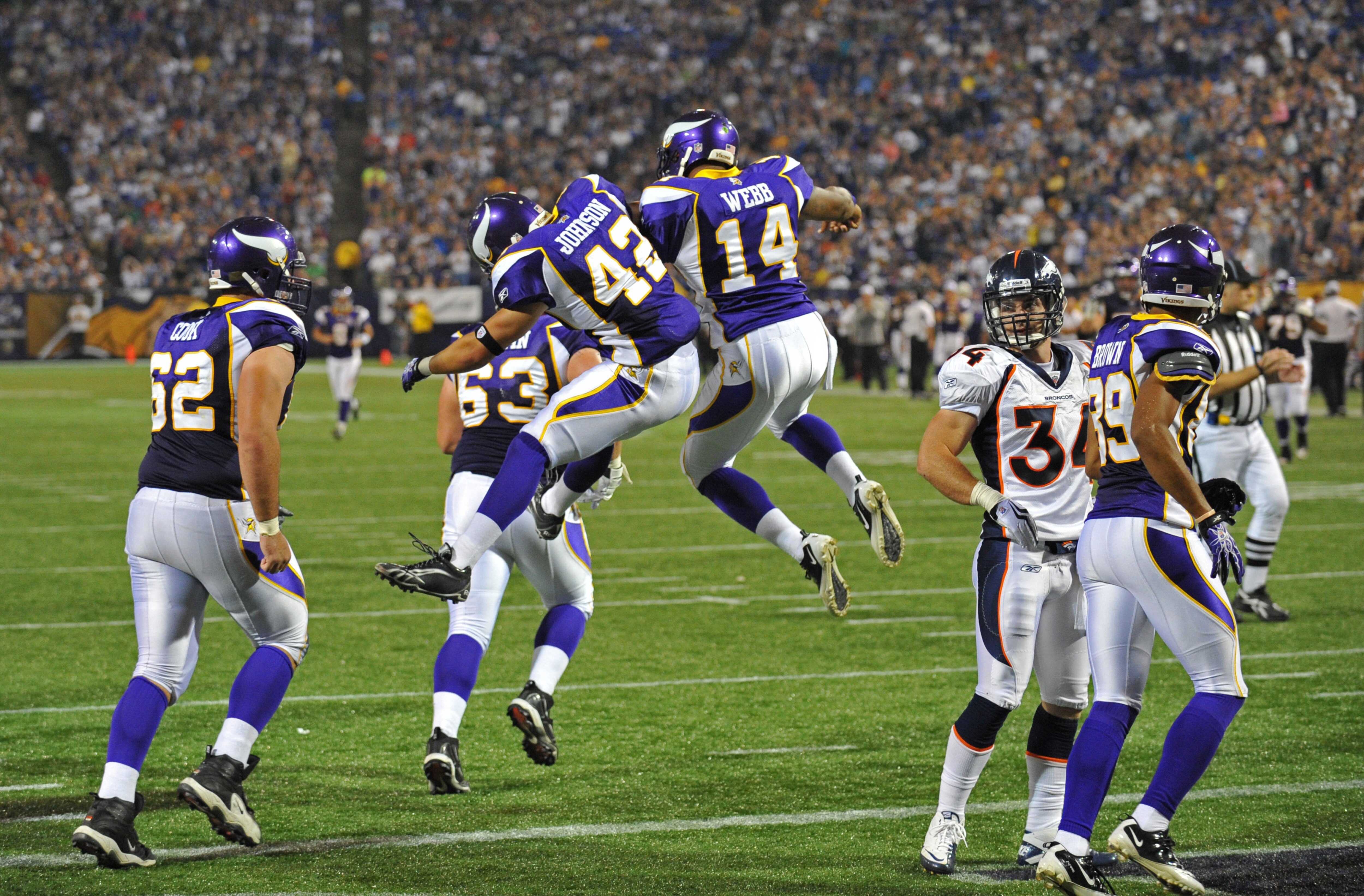MINNEAPOLIS - SEPTEMBER 02:  Ian Johnson #42 and Joe Webb #14 of the Minnesota Vikings celebrate a touchdown during an NFL preseason game against the Denver Broncos at the Mall of America Field at Hubert H. Humphrey Metrodome, on September 2, 2010 in Minn