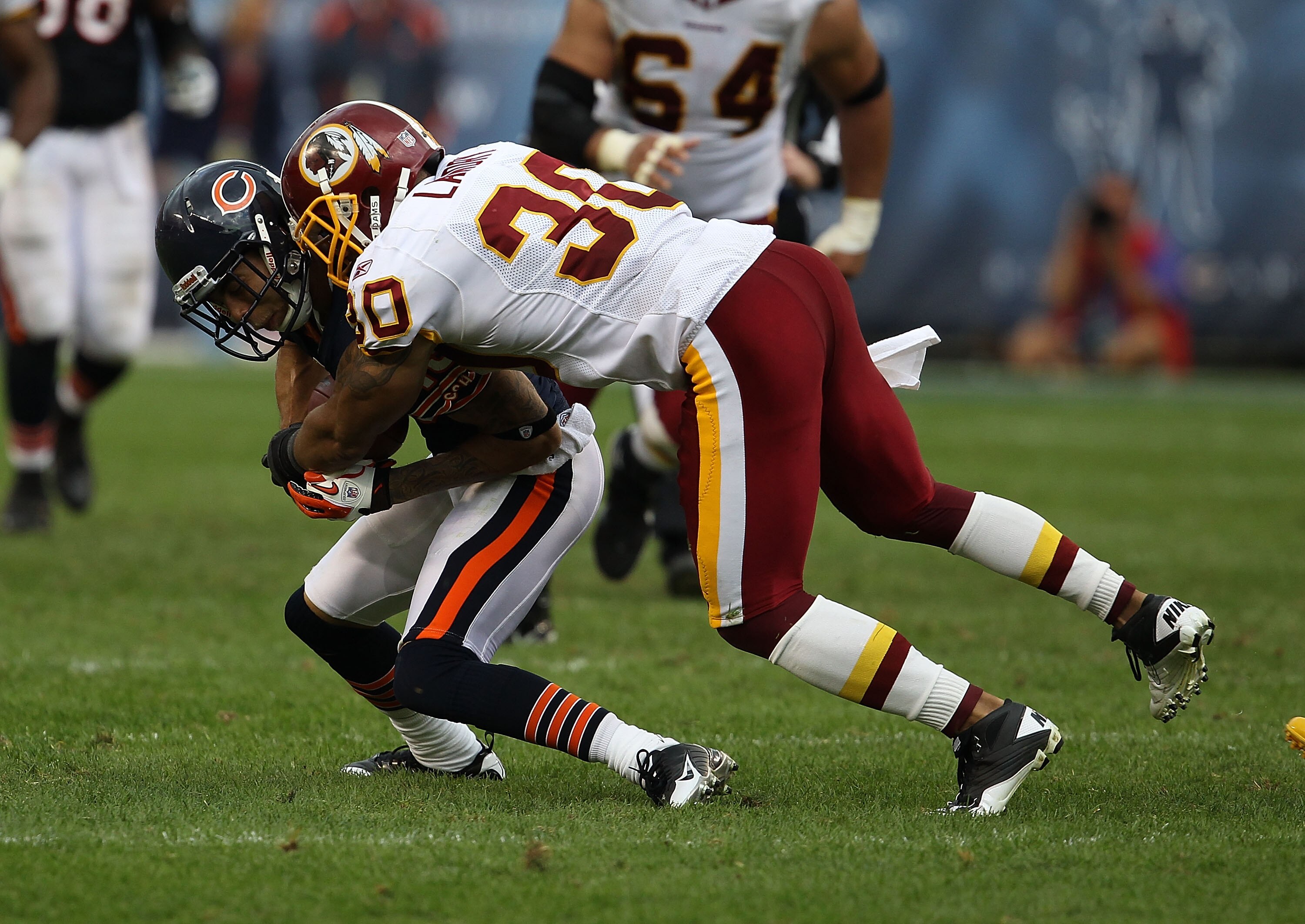 CHICAGO - OCTOBER 24: LaRon Landry #30 of the Washington Redskins tackles Johnny Knox #13 of the Chicago Bears at Soldier Field on October 24, 2010 in Chicago, Illinois. The Redskins defeated the Bears 17-14.  (Photo by Jonathan Daniel/Getty Images)