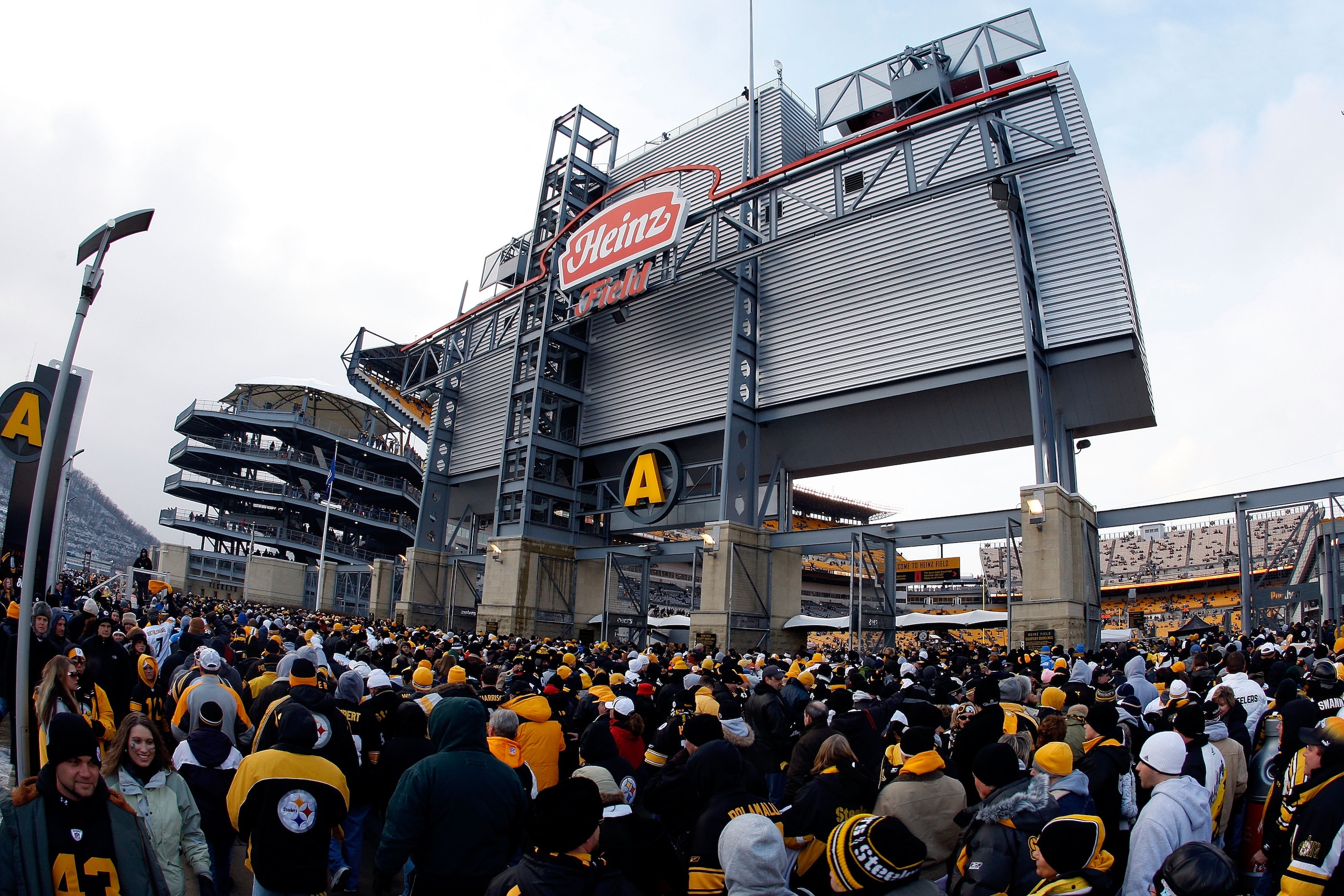 PITTSBURGH - JANUARY 11:  Fans line up outside of Heinz Field as they wait to enter the stadium for the AFC Divisional Playoff Game between the Pittsburgh Steelers and the San Diego Chargers  on January 11, 2009 at Heinz Field in Pittsburgh, Pennsylvania.