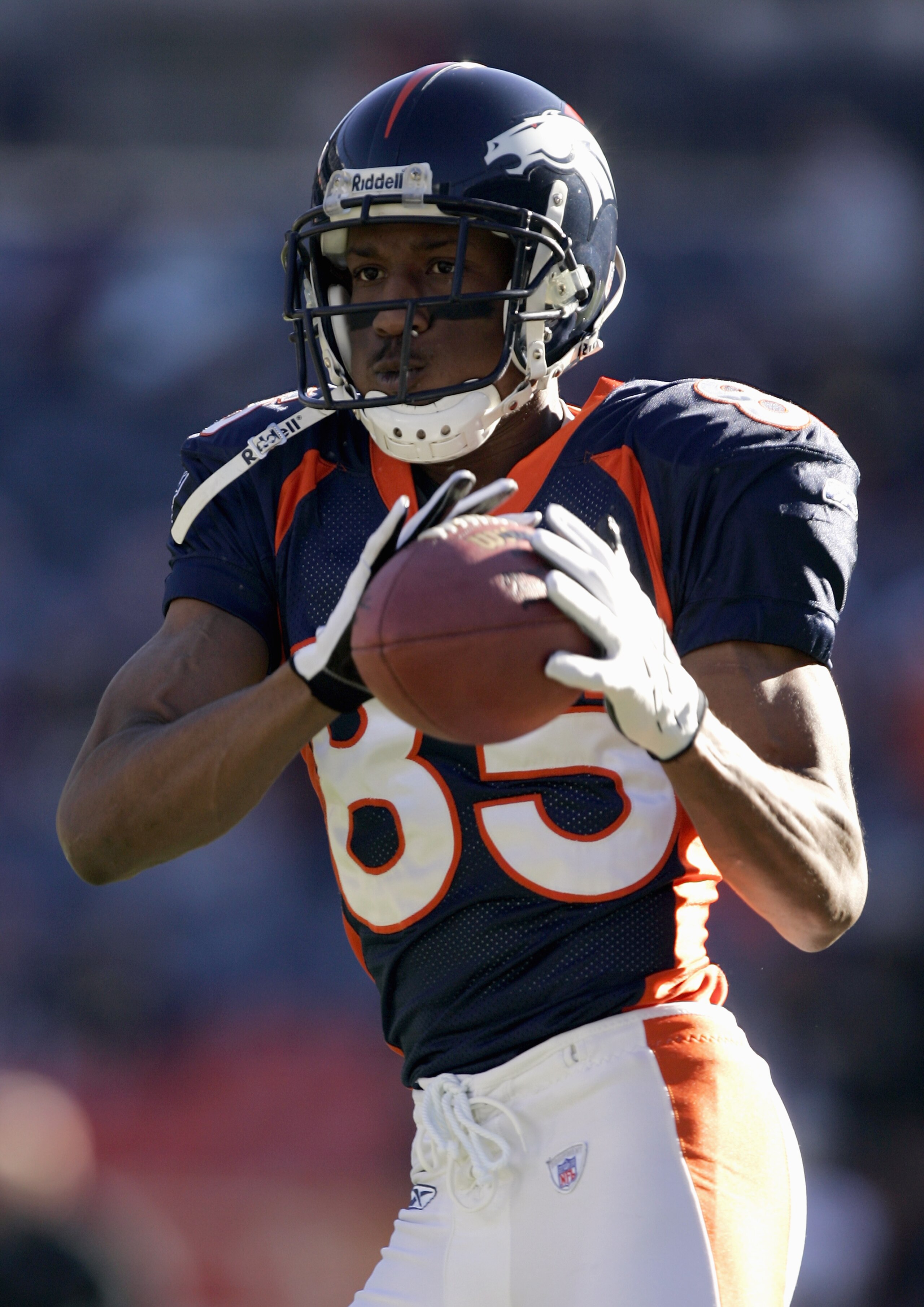 DENVER - DECEMBER 24:  Wide receiver Ashley Lelie #85 of the Denver Broncos warms up prior to the game against the Oakland Raiders on December 24, 2005 at Invesco Field at Mile High in Denver, Colorado.   The Broncos secured a bye week in the playoffs wit