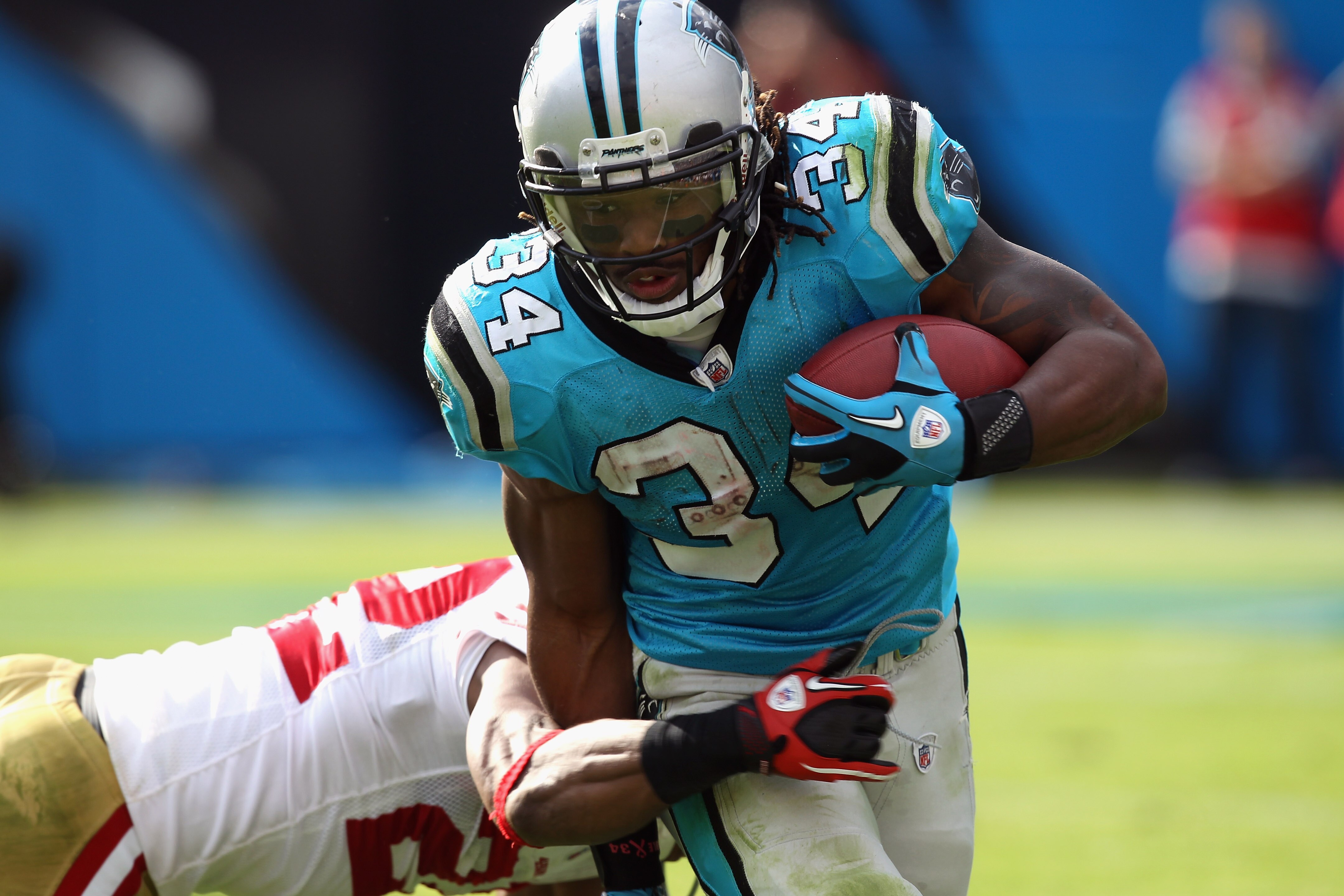 CHARLOTTE, NC - OCTOBER 24:  DeAngelo Williams #34 of the Carolina Panthers runs with the ball against the San Francisco 49ers during their game at Bank of America Stadium on October 24, 2010 in Charlotte, North Carolina.  (Photo by Streeter Lecka/Getty I