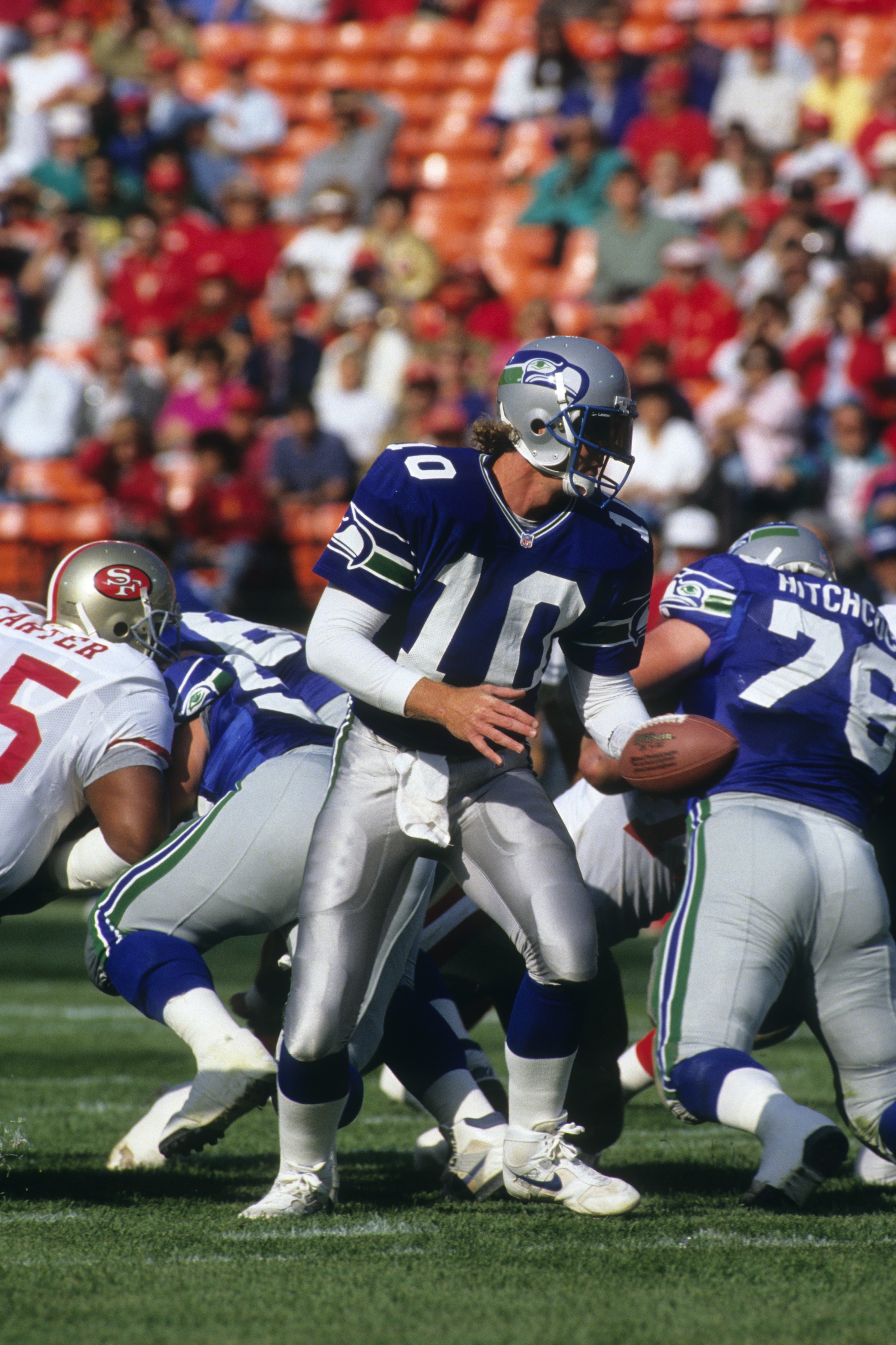SAN FRANCISCO, CA - AUGUST 28:  Quarterback Dan McGwire #10 of the Seattle Seahawks looks to hand off the ball during the exhibition game against the San Francisco 49ers at Candlestick Park on August 28, 1992 in San Francisco, California.  The 49ers won 2