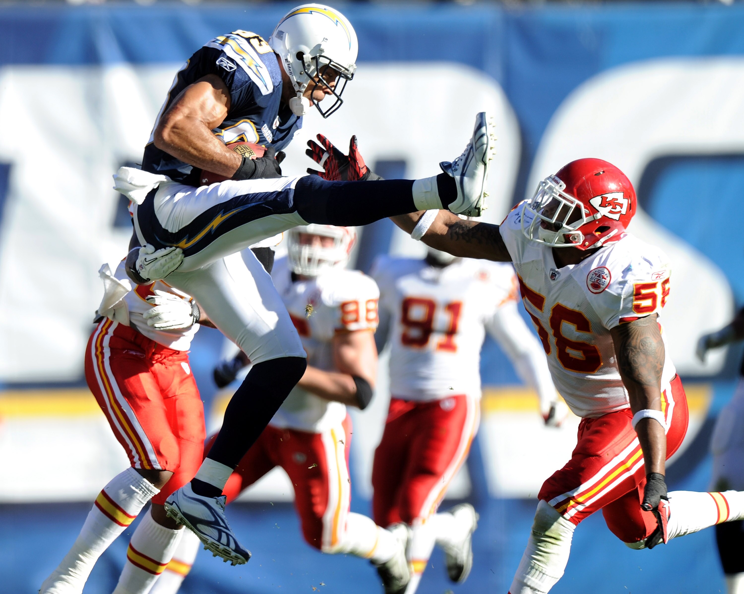 SAN DIEGO, CA - DECEMBER 12:  Vincent Jackson #83 of the San Diego Chargers makes a catch in the air in front of Derrick Johnson #56 of the Kansas City Chiefs during the first quarter at Qualcomm Stadium on December 12, 2010 in San Diego, California.  (Ph