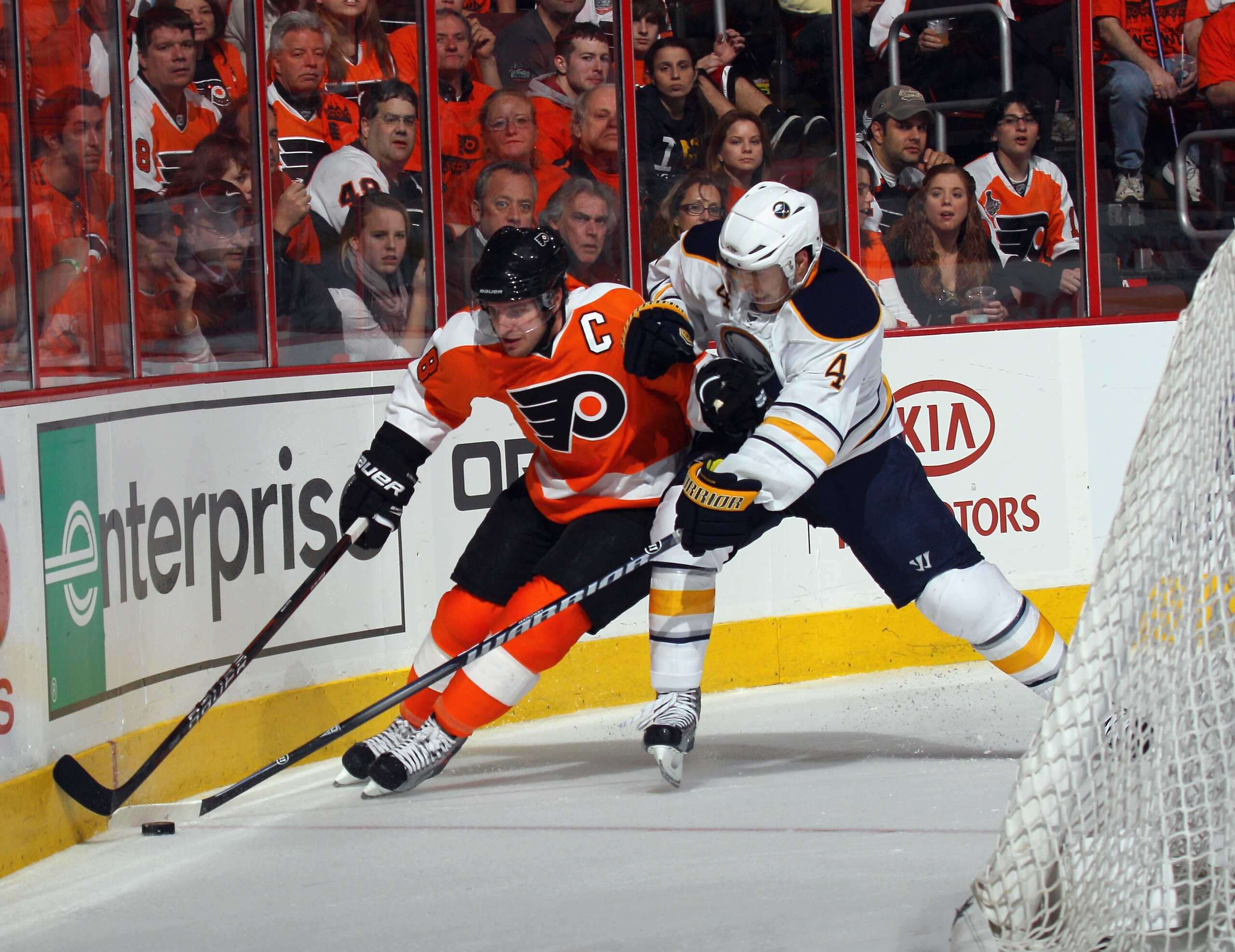 PHILADELPHIA, PA - APRIL 14: Mike Richards #18 of the Philadelphia Flyers is held by Steve Montador #4 of the Buffalo Sabres in Game One of the Eastern Conference Quarterfinals during the 2011 NHL Stanley Cup Playoffs at Wells Fargo Center on April 14, 20