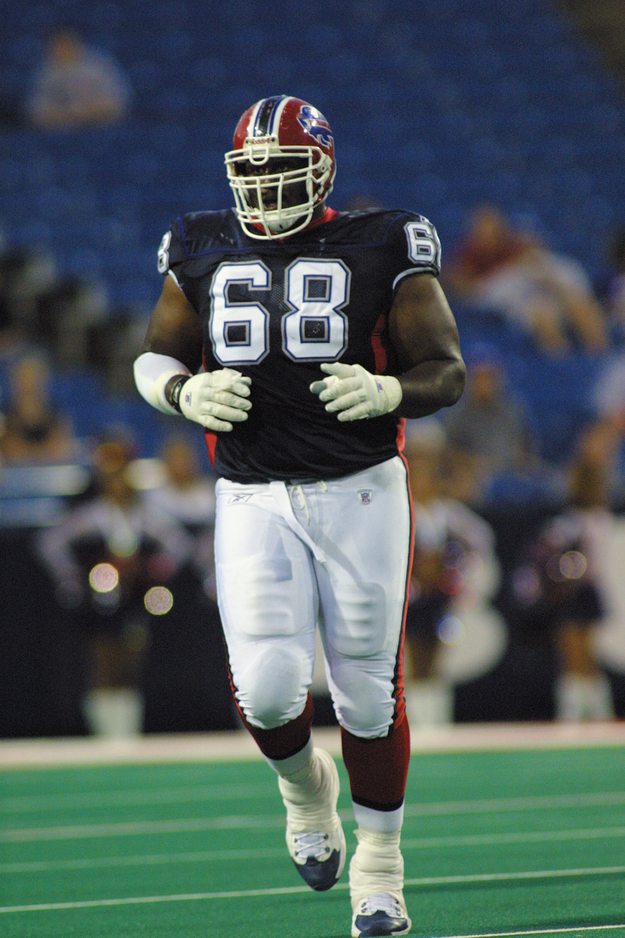 ORCHARD PARK, NY - AUGUST 9:  Tackle Mike Williams #68 of the Buffalo Bills jogs on the field during the NFL preseason game against the Cincinnati Bengals on August 9, 2002 at Ralph Wilson Stadium in Orchard Park, NY.  The Bengals defeated the Bills 24-17