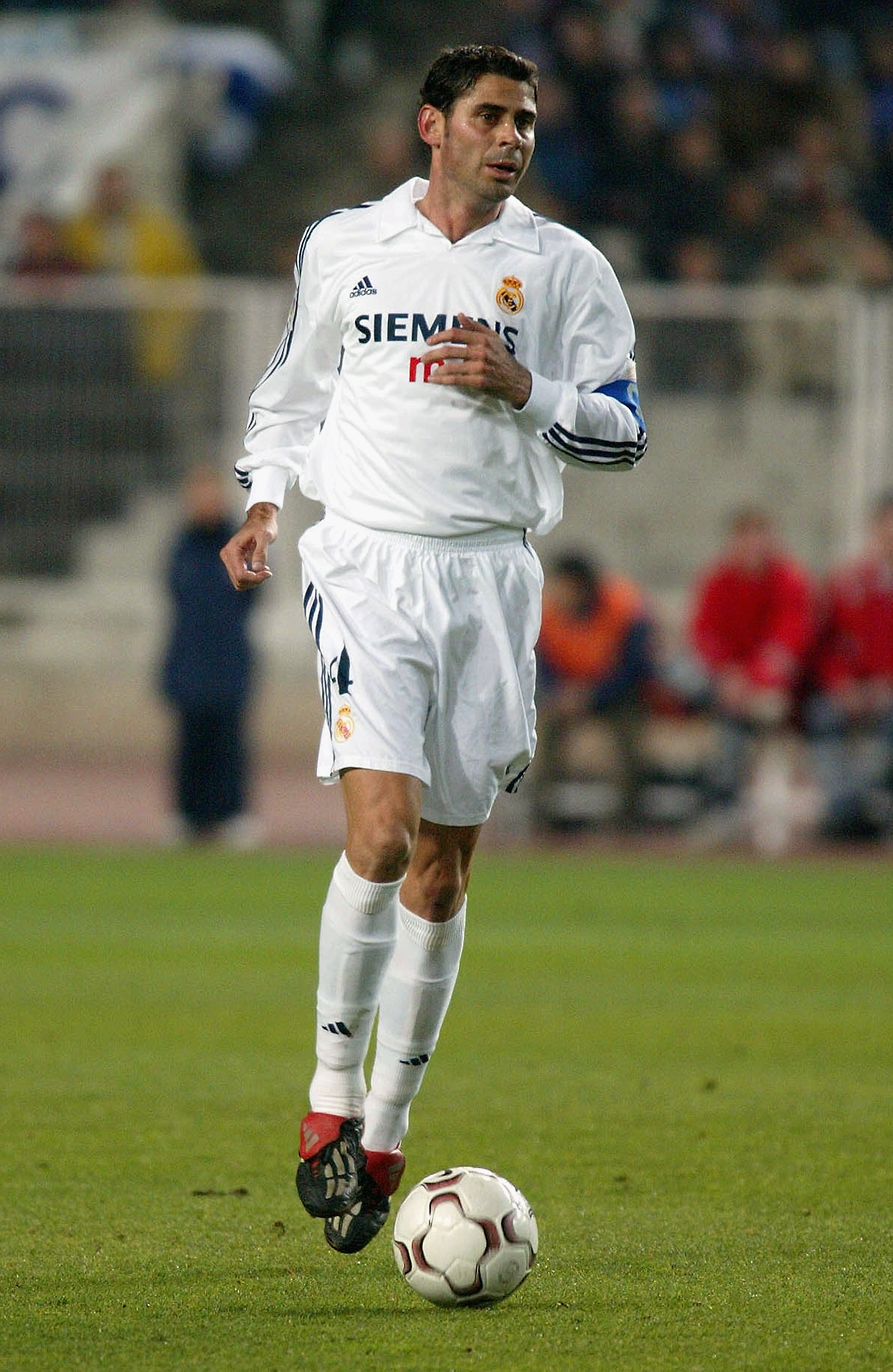 BARCELONA - FEBRUARY 2:  Fernando Hierro of Real Madrid brings the ball out of defence during the Spanish Primera Liga match between Espanyol and Real Madrid held on February 2, 2003 at the Olimpico de Montjuic Stadium, in Barcelona, Spain. The match ende