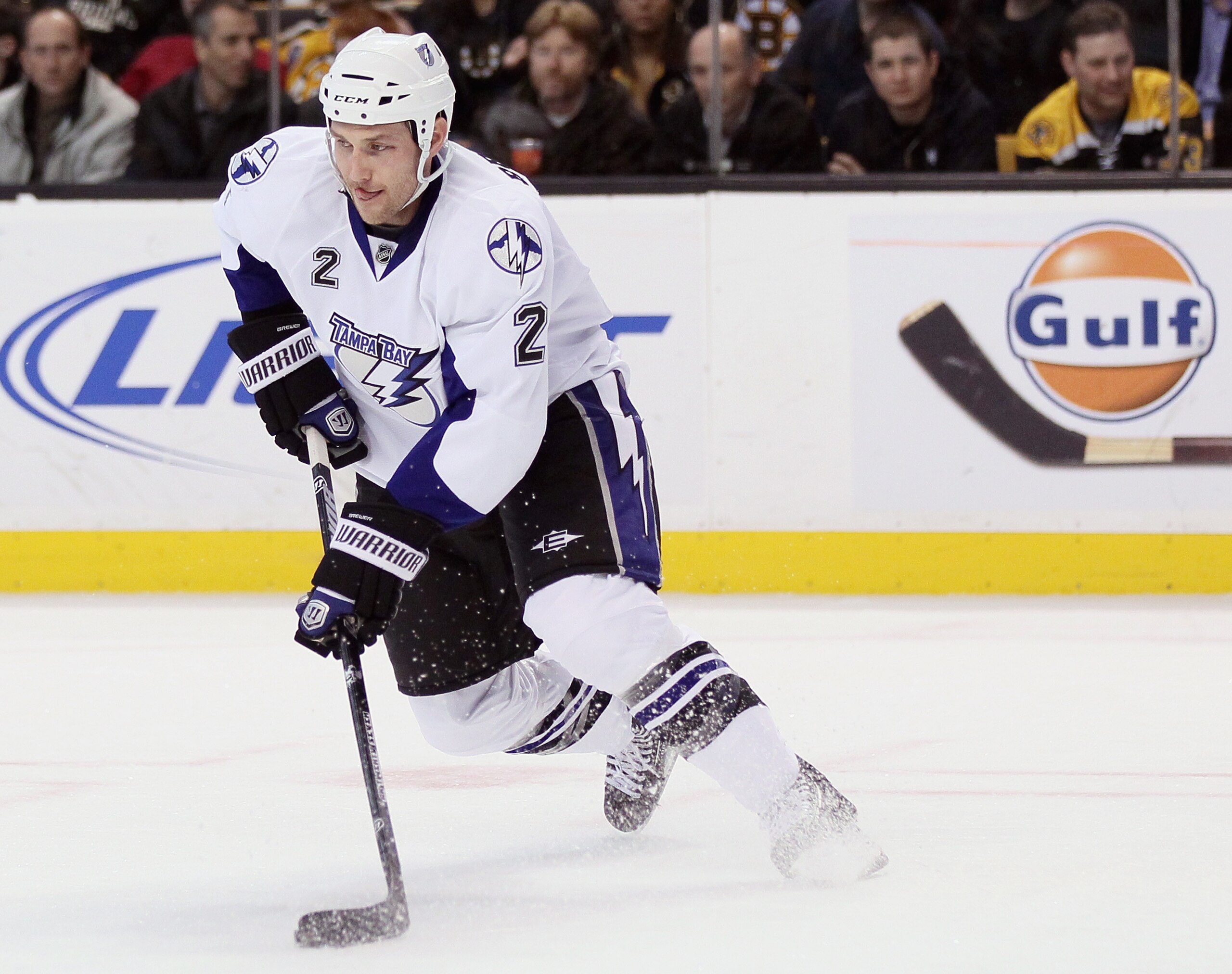 BOSTON, MA - MARCH 03:  Eric Brewer #2 of the Tampa Bay Lightning takes the puck in the third period against the Boston Bruins on March 3, 2011 at the TD Garden in Boston, Massachusetts. The Boston Bruins defeated the Tampa Bay Lightning 2-1.  (Photo by E