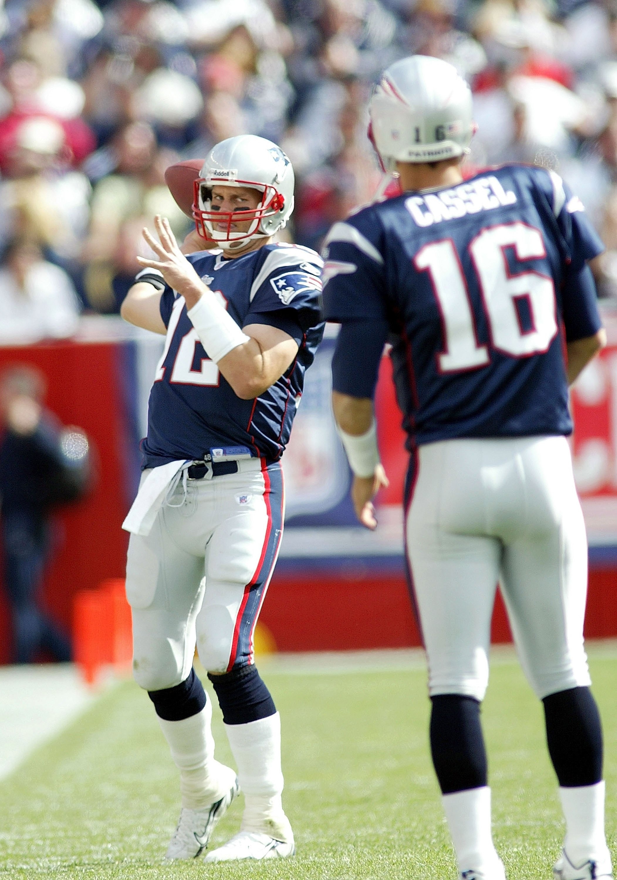 FOXBORO, MA - SEPTEMBER 10:  Tom Brady #12 of the New England Patriots keeps loose by throwing passes to Matt Cassel #16 during a timeout against the Buffalo Bills on September 10, 2006 at Gillette Stadium in Foxboro, Massachusetts. The Patriots defeated