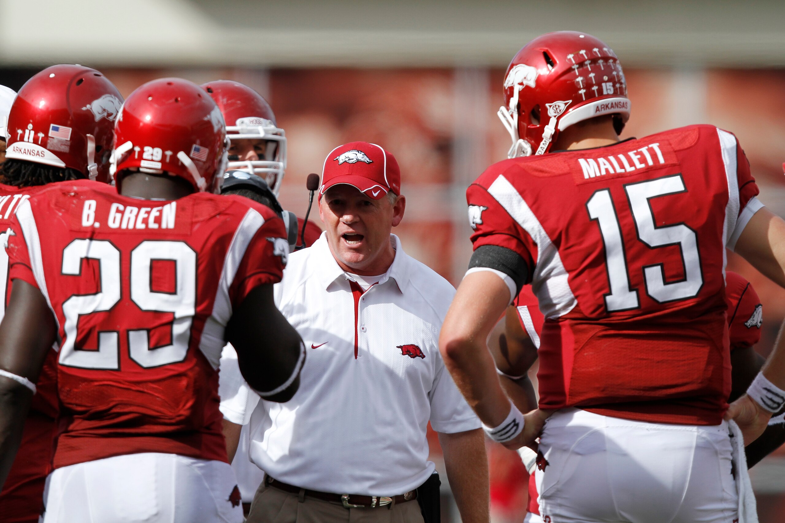 FAYETTEVILLE - SEPTEMBER 25: Arkansas Razorbacks head coach Bobby Petrino (C) talks to his players during the game against the Alabama Crimson Tide at Donald W. Reynolds Razorback Stadium on September 25, 2010 in Fayetteville, Arkansas. Alabama won 24-20. FAYETTEVILLE - SEPTEMBER 25: Arkansas Razorbacks head coach Bobby Petrino (C) talks to his players during the game against the Alabama Crimson Tide at Donald W. Reynolds Razorback Stadium on September 25, 2010 in Fayetteville, Arkansas. Alabama won 24-20.