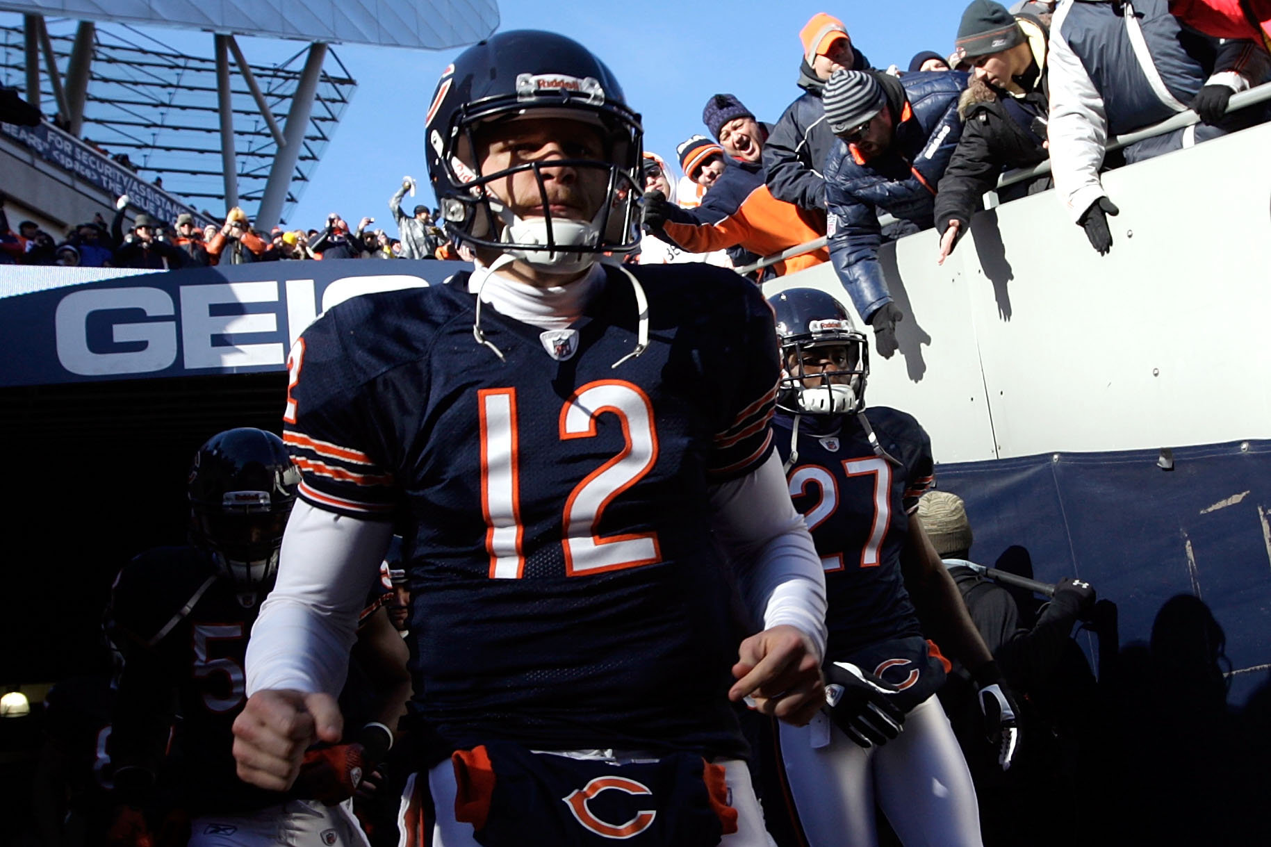 CHICAGO, IL - JANUARY 23:  Caleb Hanie #12 of the Chicago Bears runs out of the tunnel to take on the Green Bay Packers during the NFC Championship Game at Soldier Field on January 23, 2011 in Chicago, Illinois.  (Photo by Jamie Squire/Getty Images)