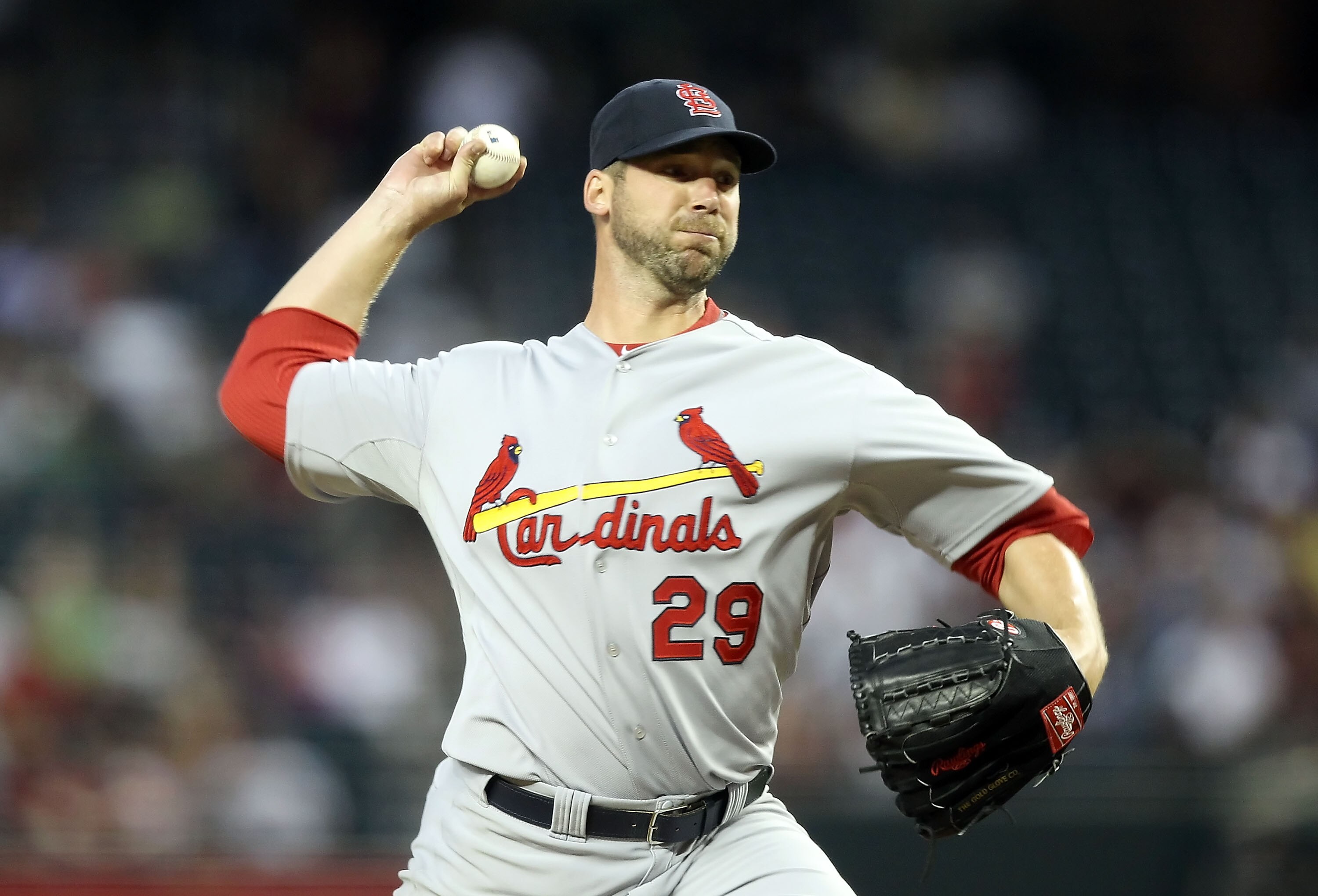 PHOENIX, AZ - APRIL 12:  Starting pitcher Chris Carpenter #29 of the St. Louis Cardinals pitches against the Arizona Diamondbacks during the Major League Baseball game at Chase Field on April 12, 2011 in Phoenix, Arizona. The Diamondbacks defeated the Car