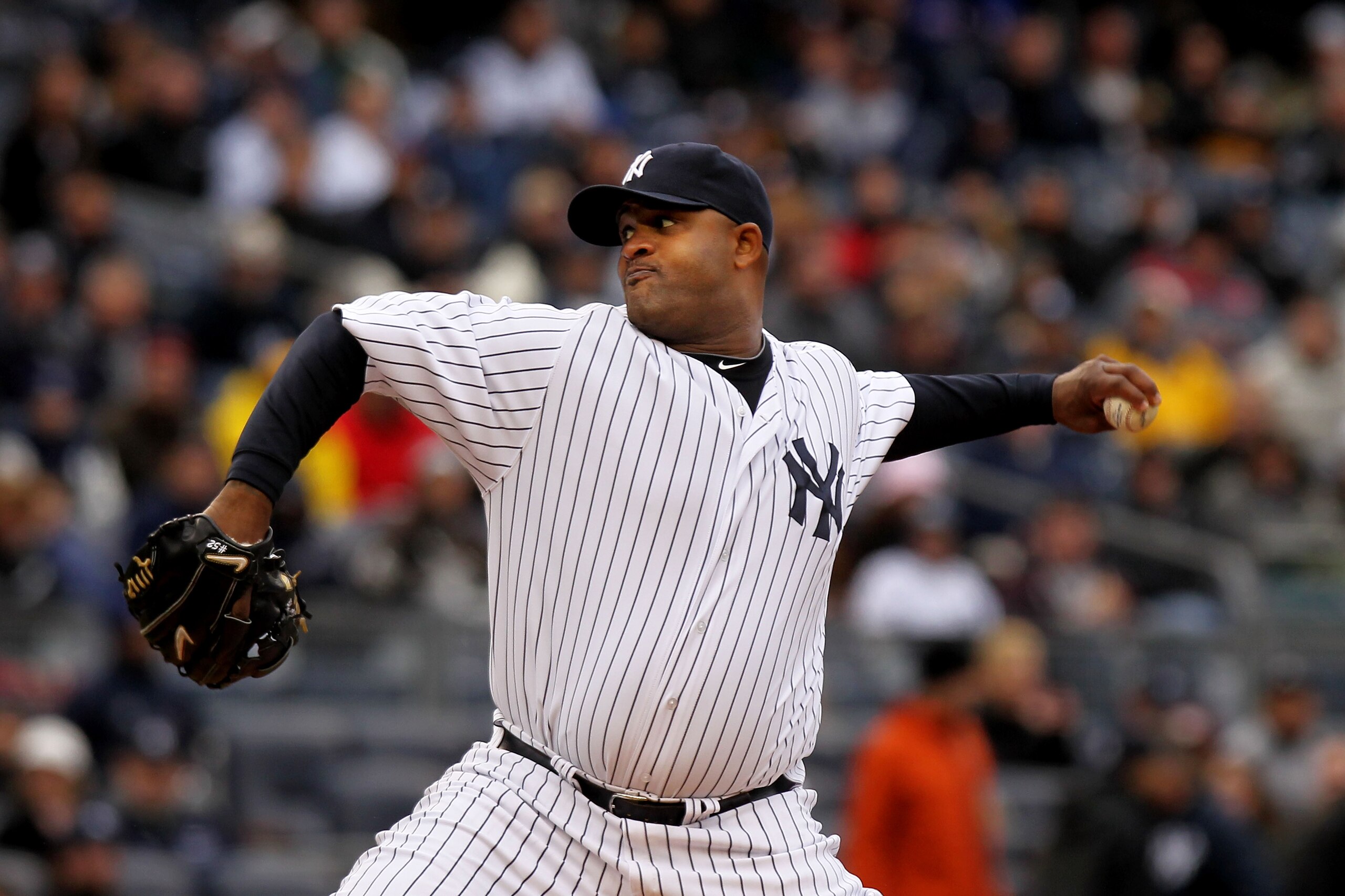NEW YORK, NY - MARCH 31: CC Sabathia #52 of the New York Yankees throws a pitch during the first inning against the Detroit Tigers on Opening Day at Yankee Stadium on March 31, 2011 in New York City. (Photo by Nick Laham/Getty Images) NEW YORK, NY - MARCH 31: CC Sabathia #52 of the New York Yankees throws a pitch during the first inning against the Detroit Tigers on Opening Day at Yankee Stadium on March 31, 2011 in New York City. (Photo by Nick Laham/Getty Images)