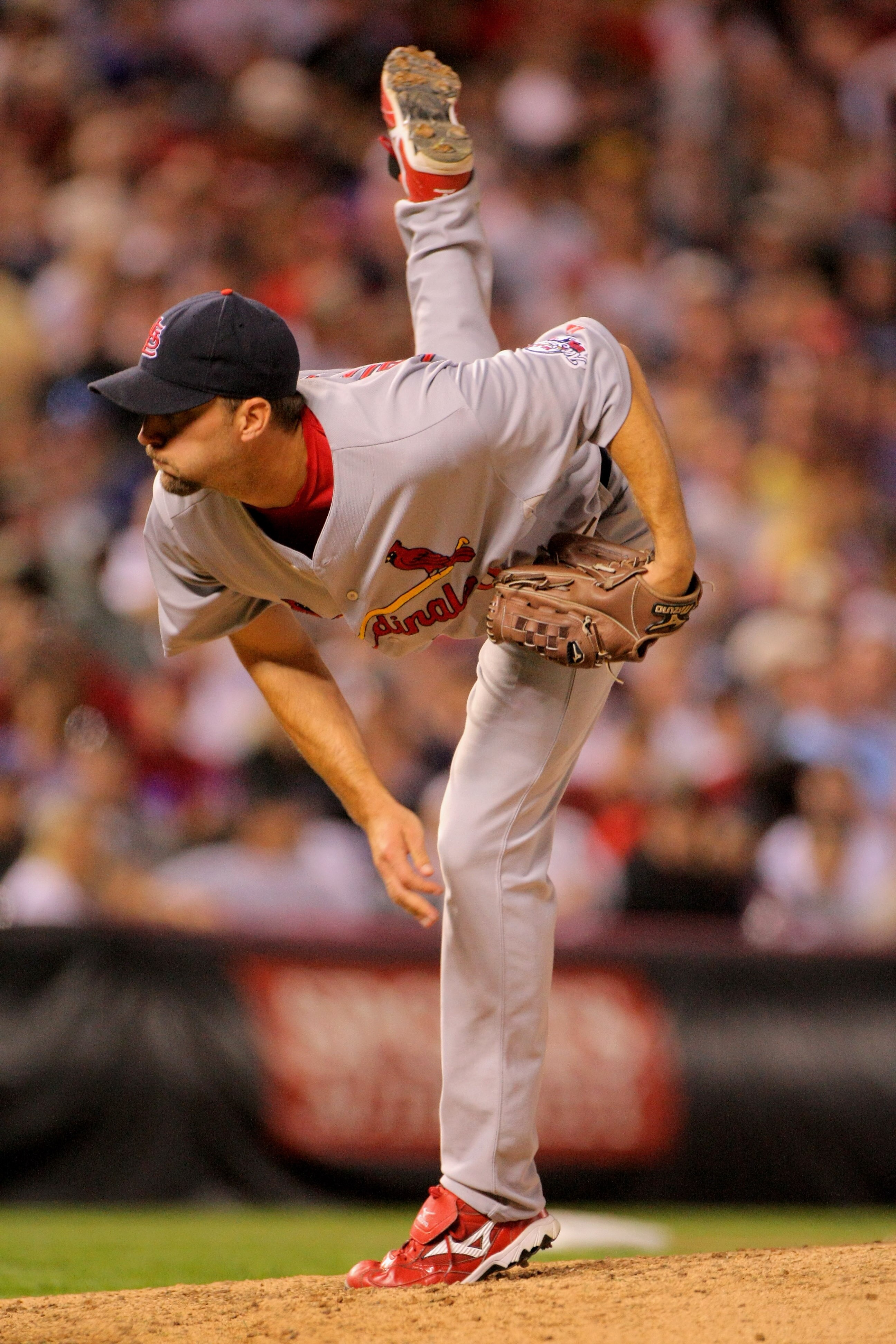 DENVER - SEPTEMBER 26:  Starting pitcher Adam Wainright #50 of the St. Louis Cardinals pitches against the Colorado Rockies at Coors Field on September 26, 2009 in Denver, Colorado. Wainright earned the win as the Cardinals clinched the National League Ce
