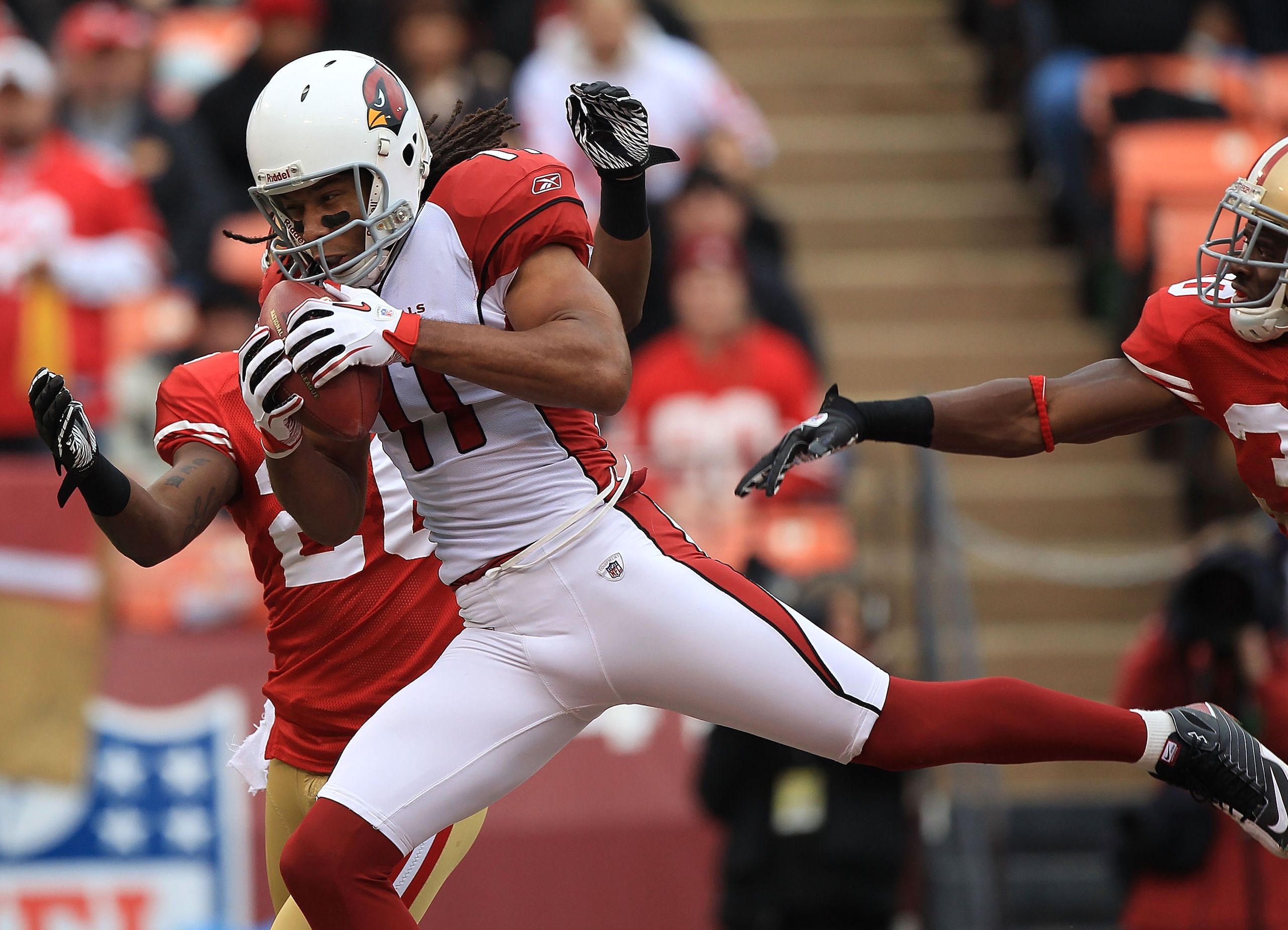 SAN FRANCISCO, CA - JANUARY 2:  Larry Fitzgerald #11 of the Arizona Cardinals catches a touchdown against the San Francisco 49er during an NFL game at Candlestick Park on January 2, 2011 in San Francisco, California.(Photo by Jed Jacobsohn/Getty Images)