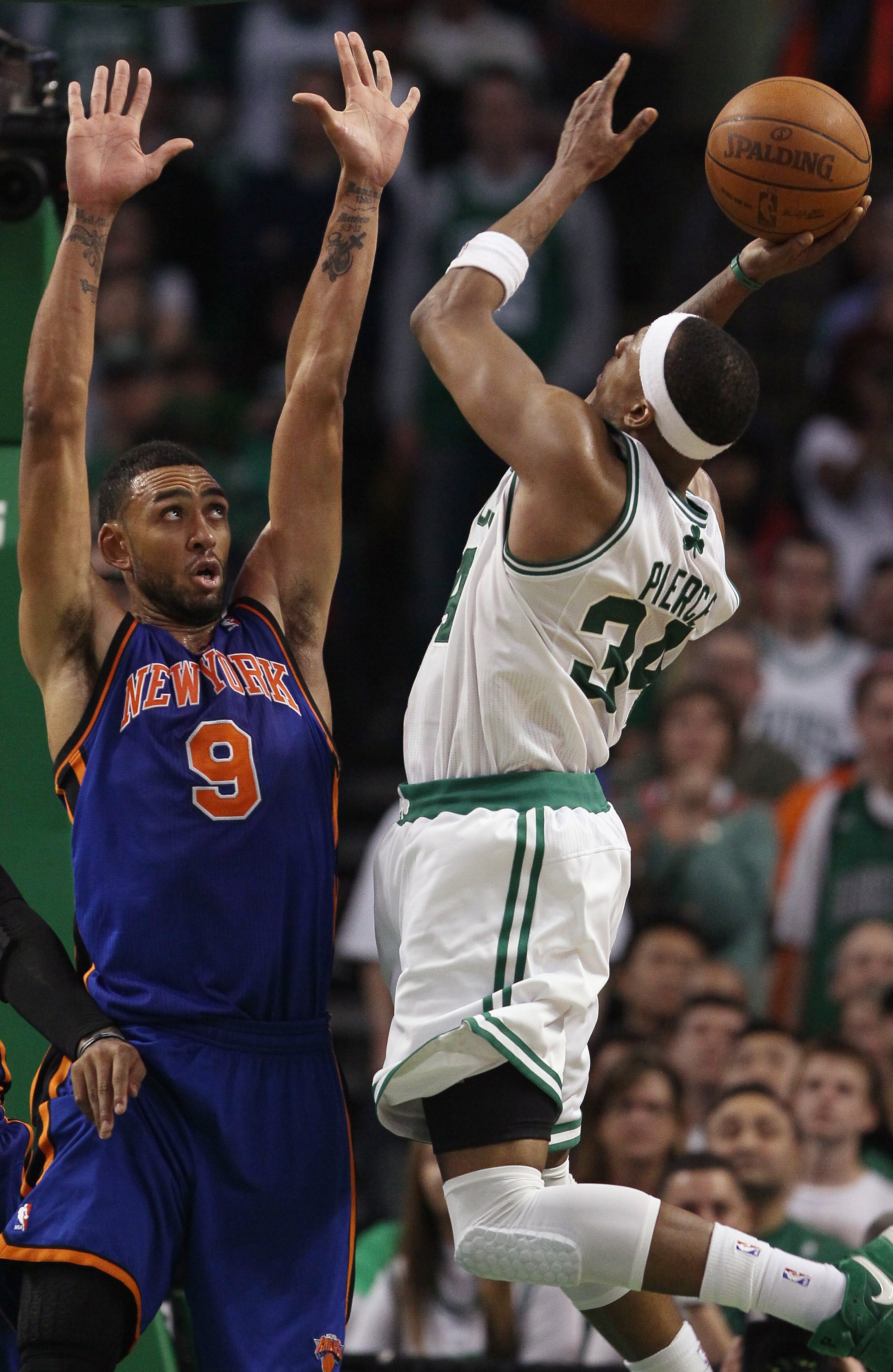 BOSTON, MA - APRIL 19:  Paul Pierce #34 of the Boston Celtics takes a shot as Jared Jeffries #9 of the New York Knicks in Game Two of the Eastern Conference Quarterfinals in the 2011 NBA Playoffs on April 19, 2011 at the TD Garden in Boston, Massachusetts