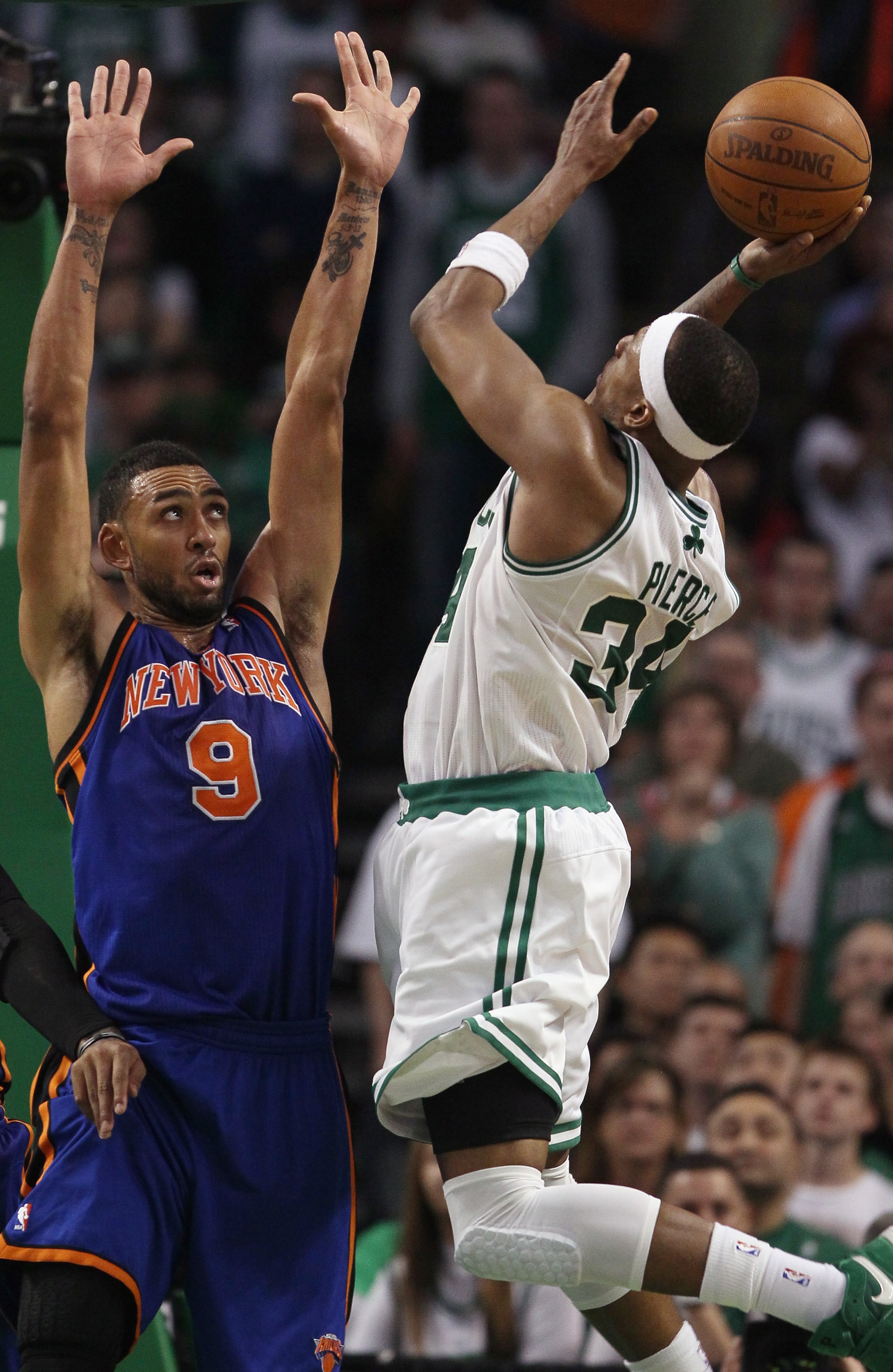BOSTON, MA - APRIL 19: Paul Pierce #34 of the Boston Celtics takes a shot as Jared Jeffries #9 of the New York Knicks in Game Two of the Eastern Conference Quarterfinals in the 2011 NBA Playoffs on April 19, 2011 at the TD Garden in Boston, Massachusetts BOSTON, MA - APRIL 19: Paul Pierce #34 of the Boston Celtics takes a shot as Jared Jeffries #9 of the New York Knicks in Game Two of the Eastern Conference Quarterfinals in the 2011 NBA Playoffs on April 19, 2011 at the TD Garden in Boston, Massachusetts